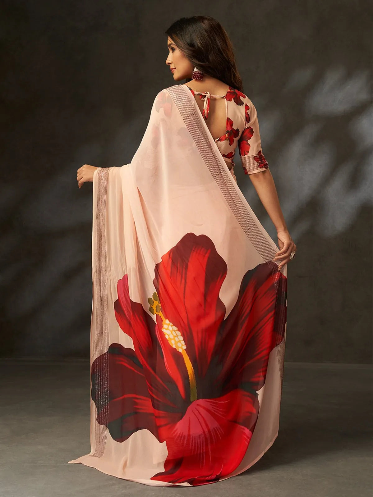 Tarani peach georgette silk saree back view with floral blouse design