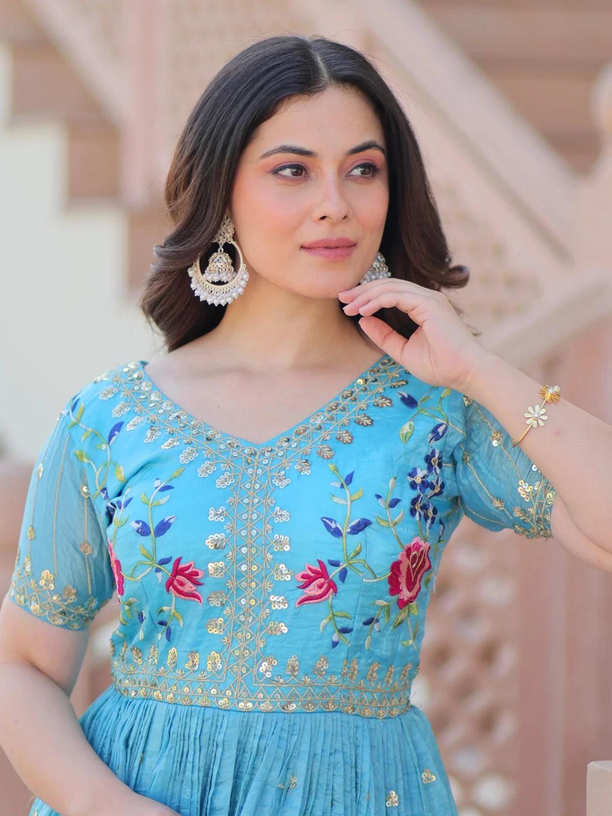 Tarani blue gold crush gown upper body closeup showing embroidery and sequins work