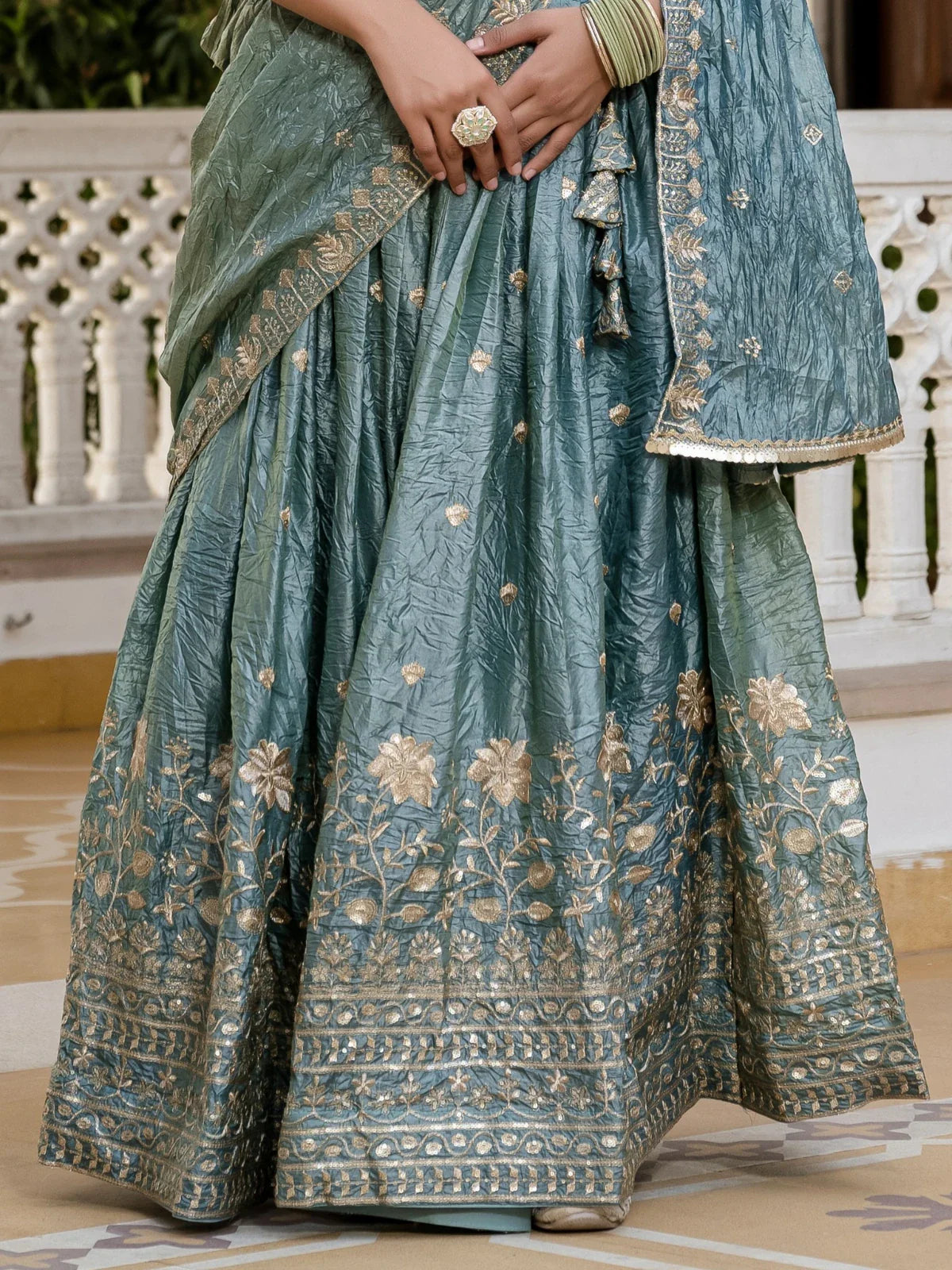 Tarani gold crush lehenga closeup of border embroidery work green shade