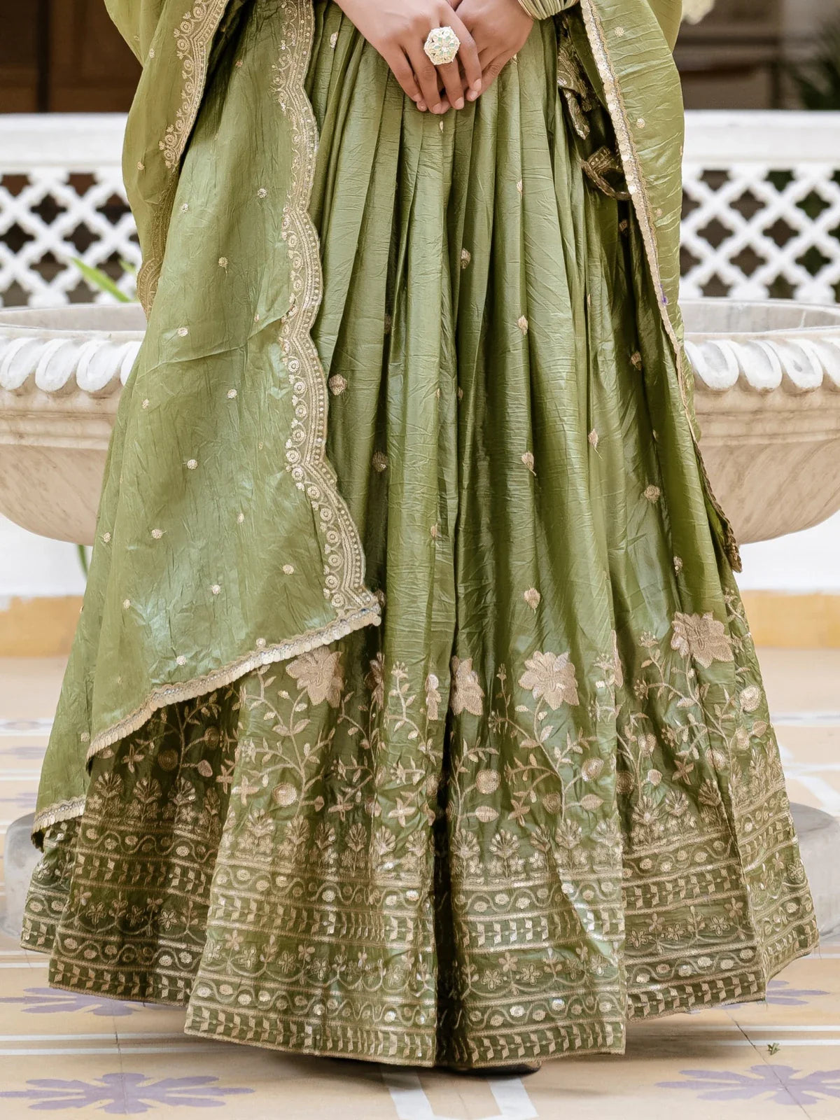 Tarani detailed green gold crush lehenga fabric closeup with embroidery and texture