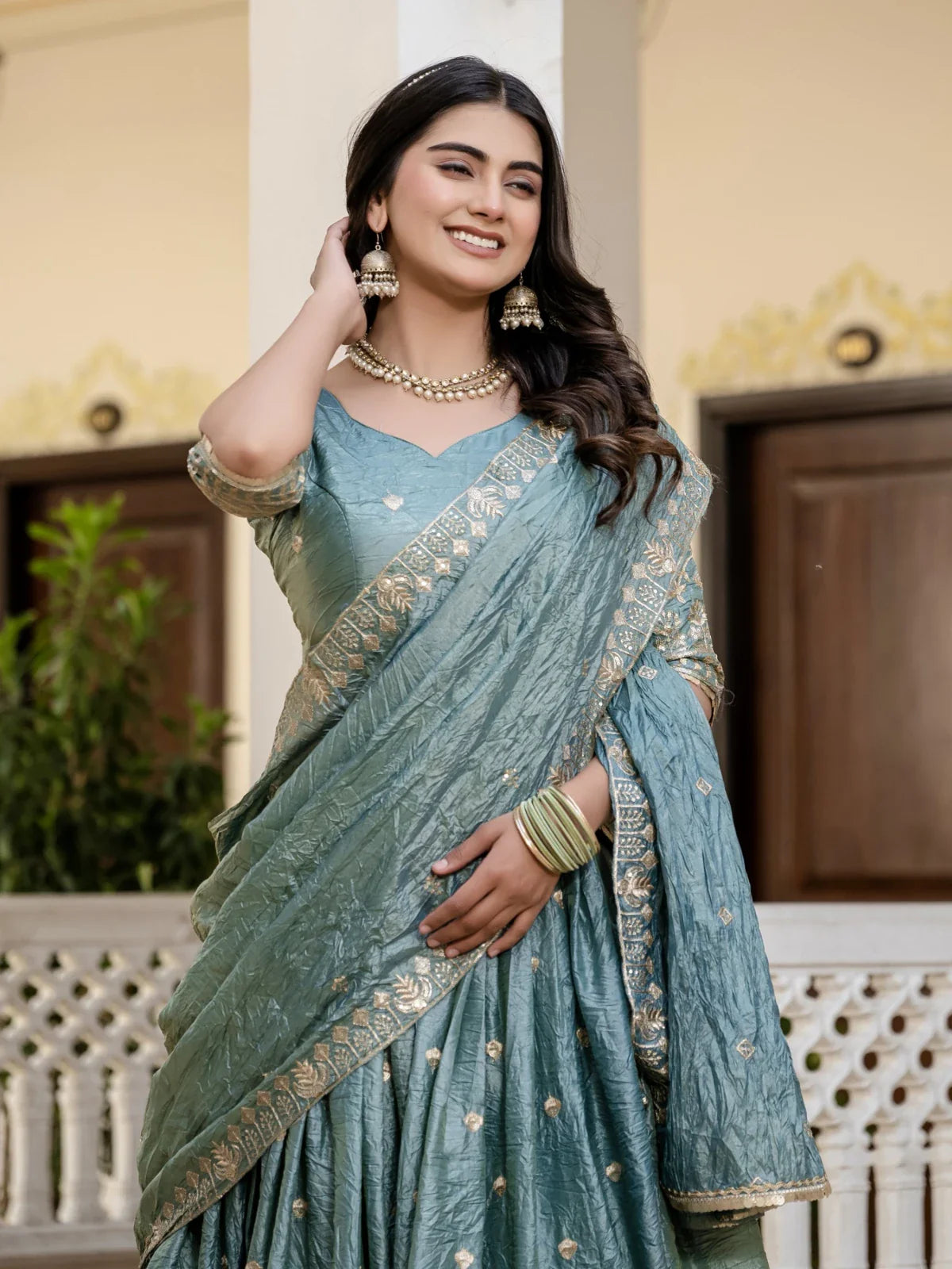 Tarani gold crush green lehenga upper body closeup with embroidery details