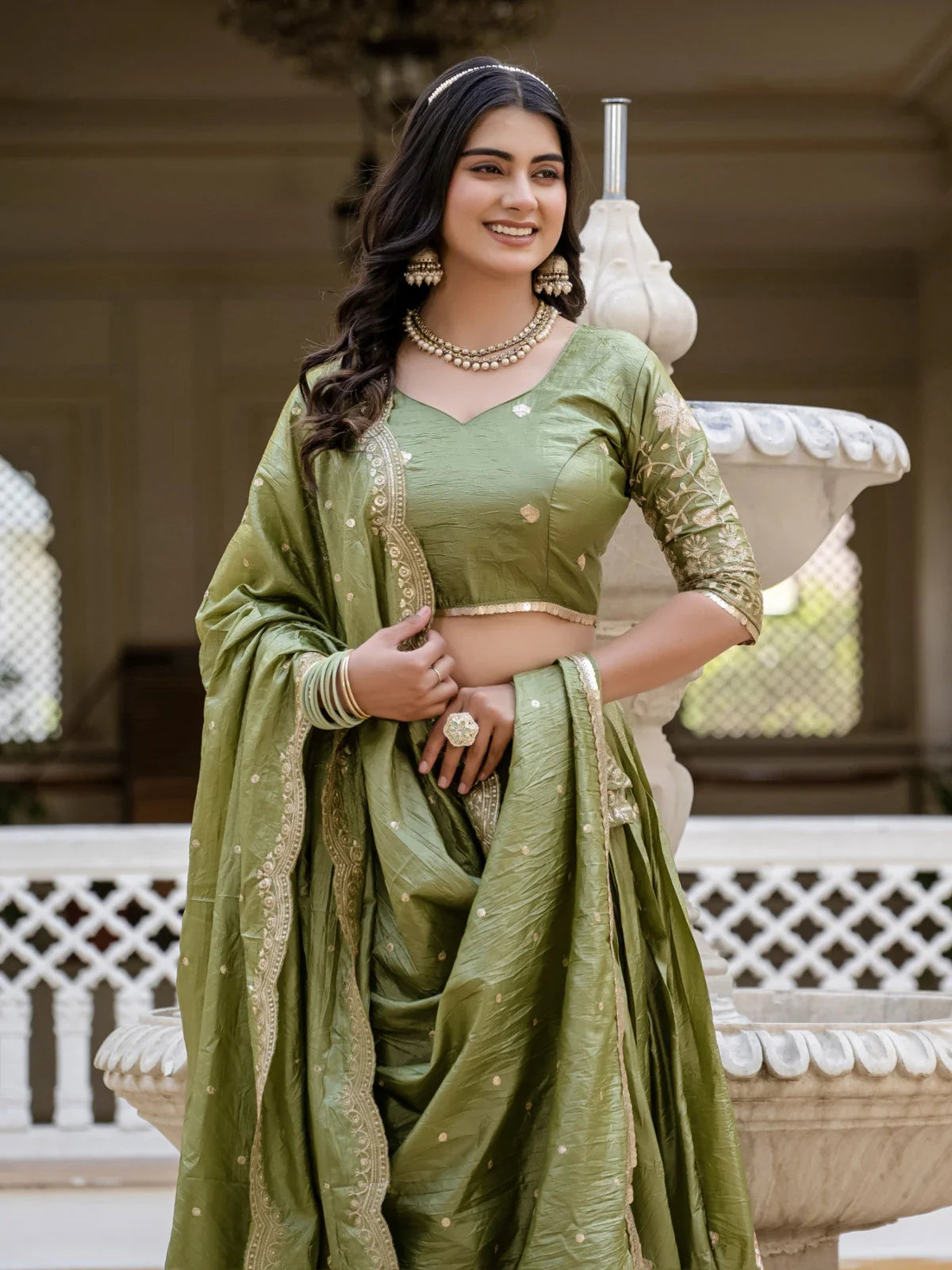 Tarani elegant green gold crush lehenga upper body view highlighting blouse embroidery