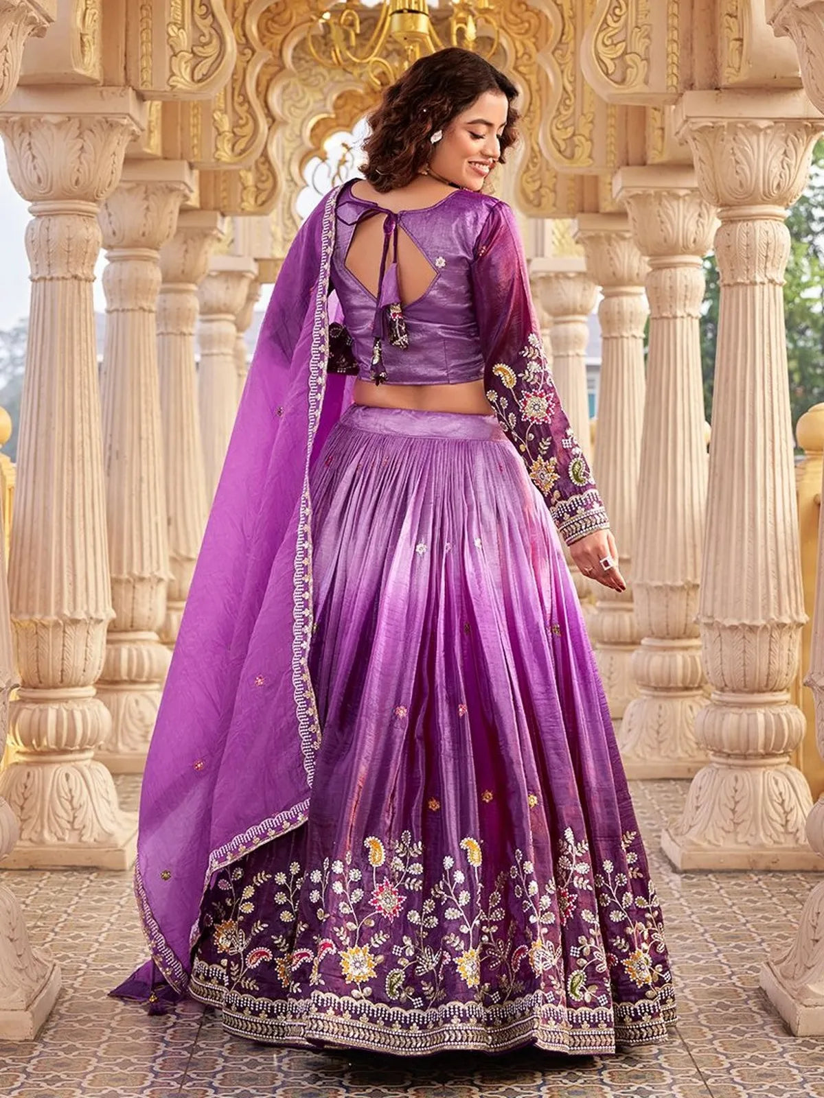 Tarani purple lehenga back view with tassel blouse and detailed dupatta