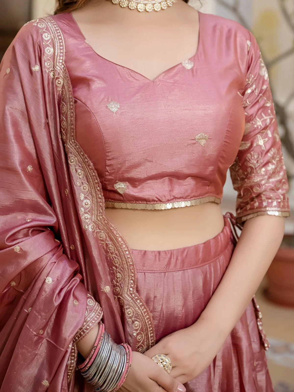 Tarani rose pink gold crush lehenga blouse closeup showing neckline and design