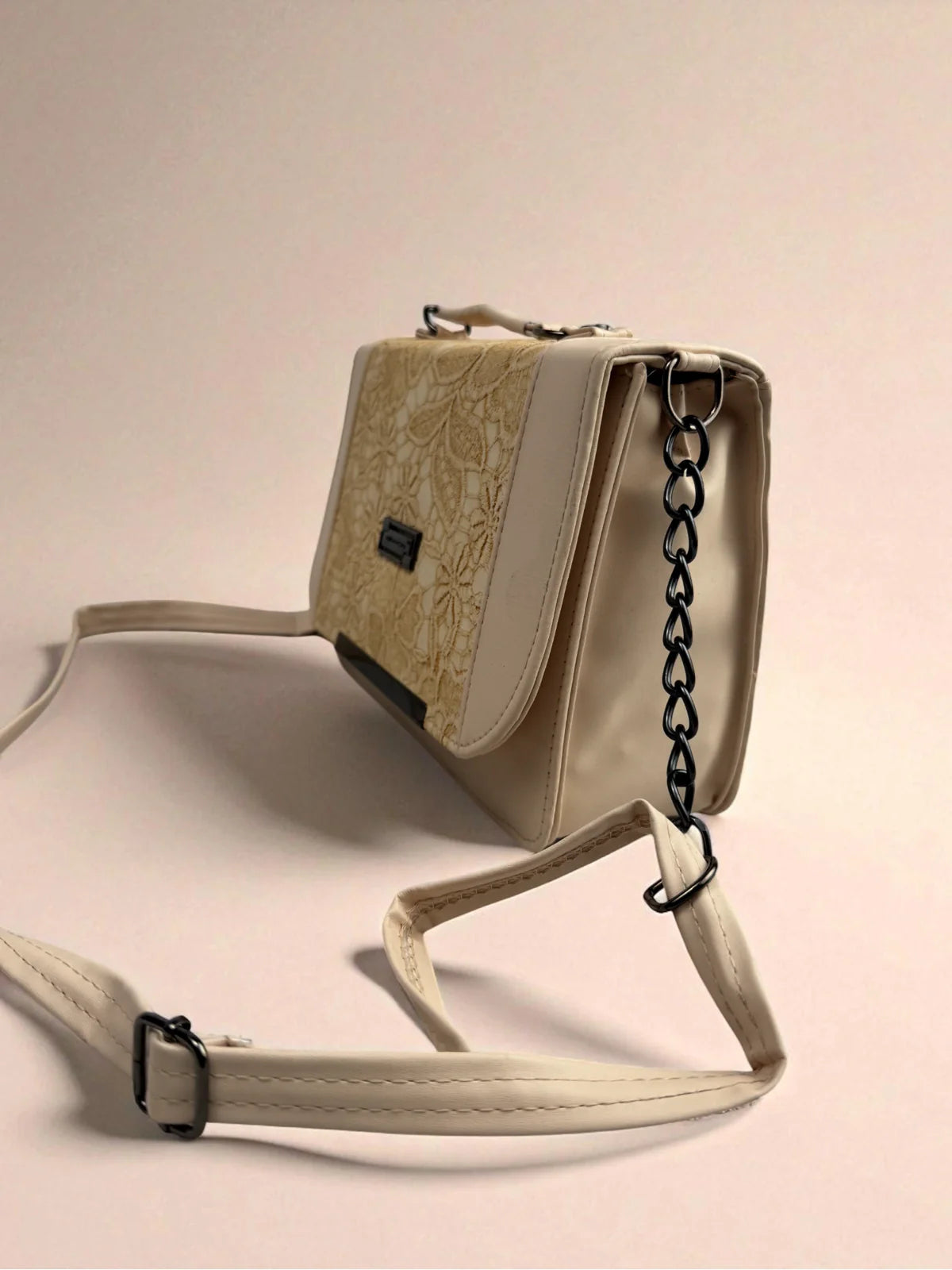 Tarani beige PU leather handbag with floral lace design side view