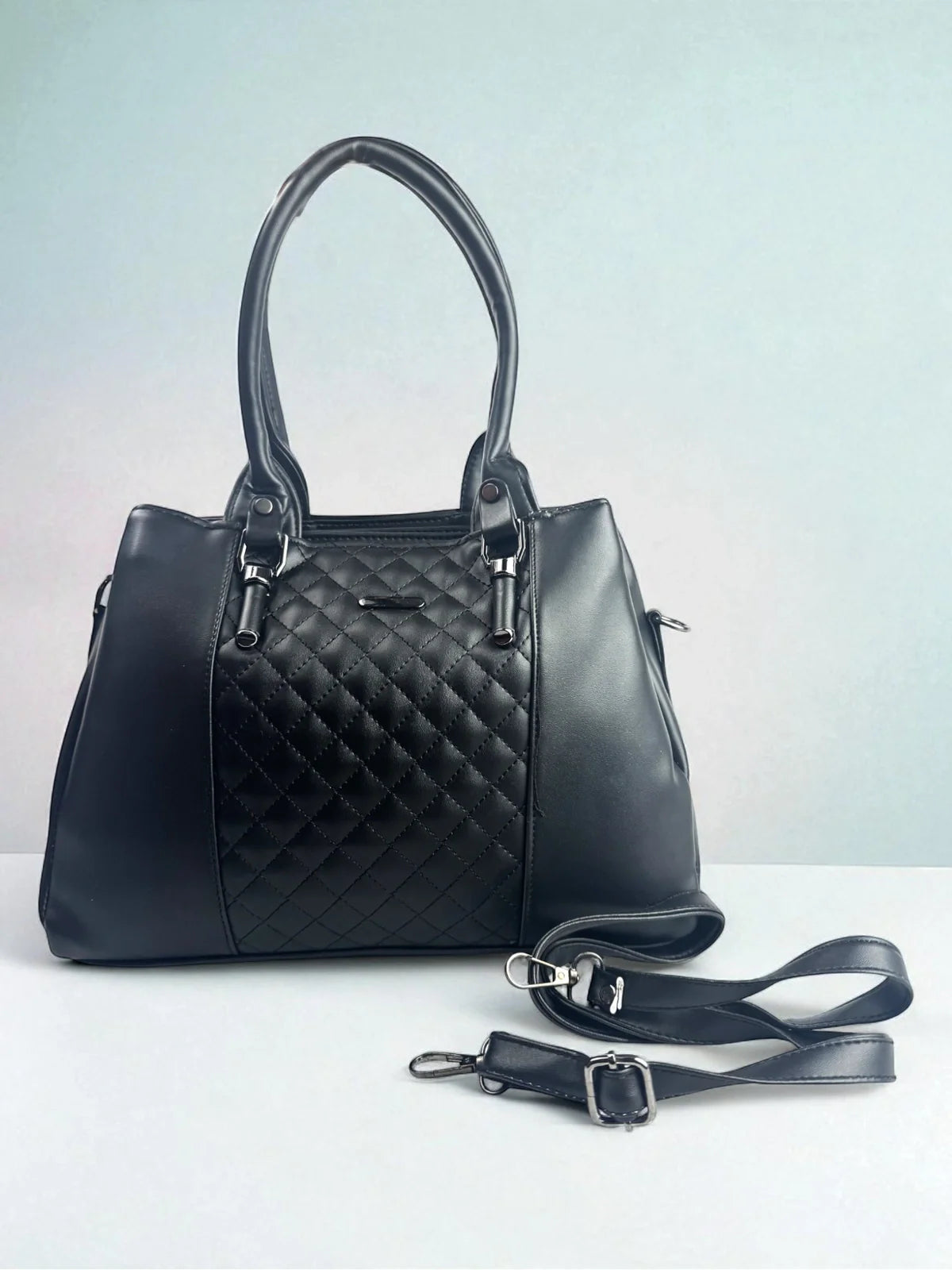 Tarani black PU leather handbag with quilted design for office and festive use