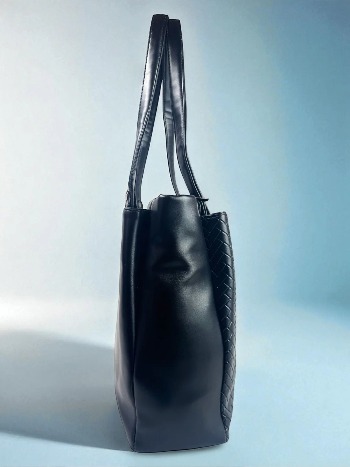 Tarani black PU leather handbag sleek side profile view