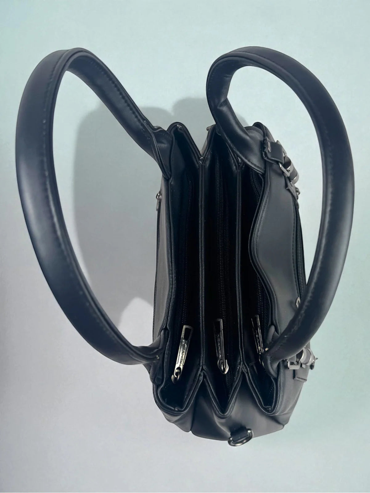 Tarani black PU leather handbag top compartments spacious design