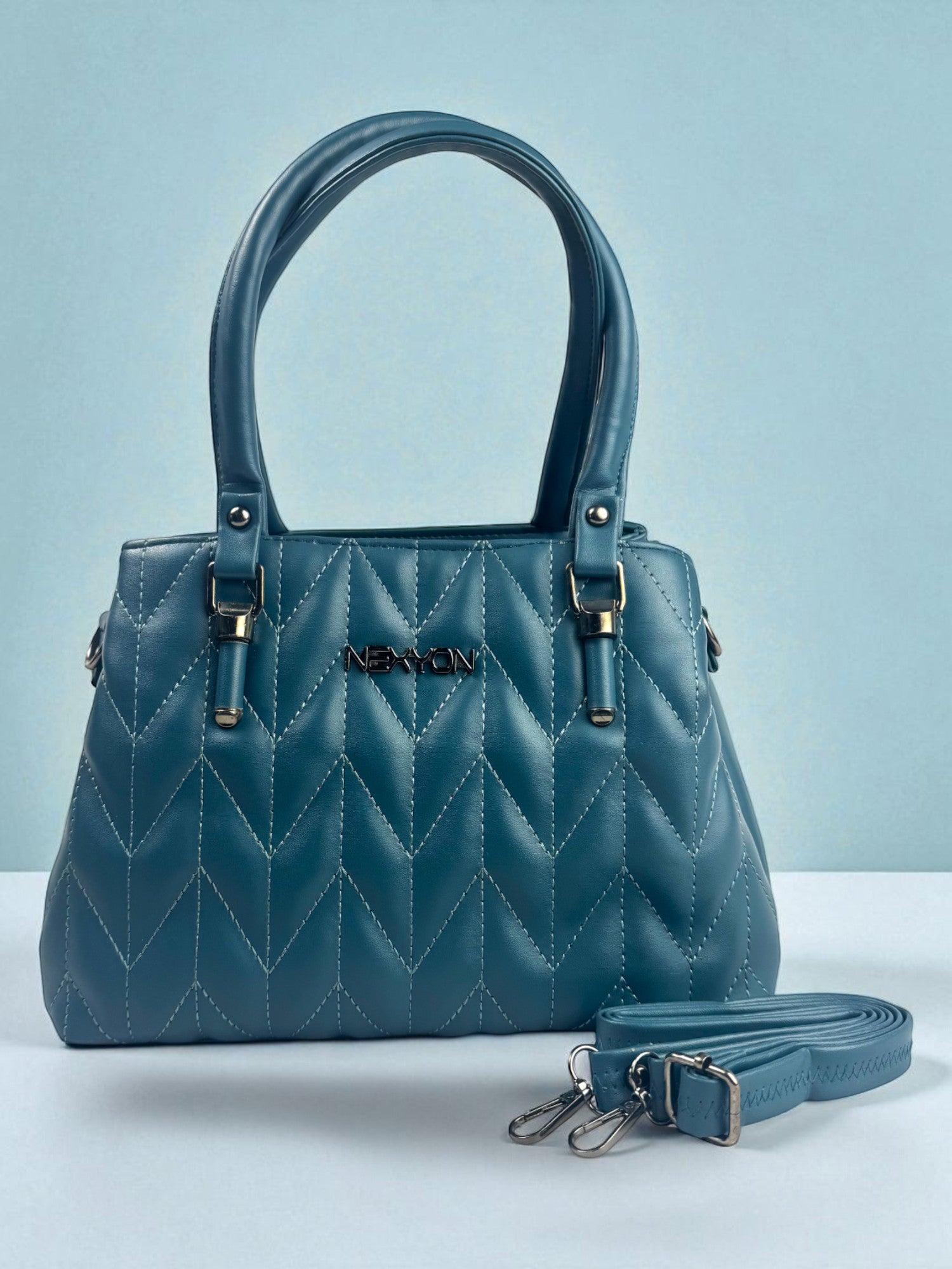 Tarani blue PU leather handbag front view showing depth and elegant shape
