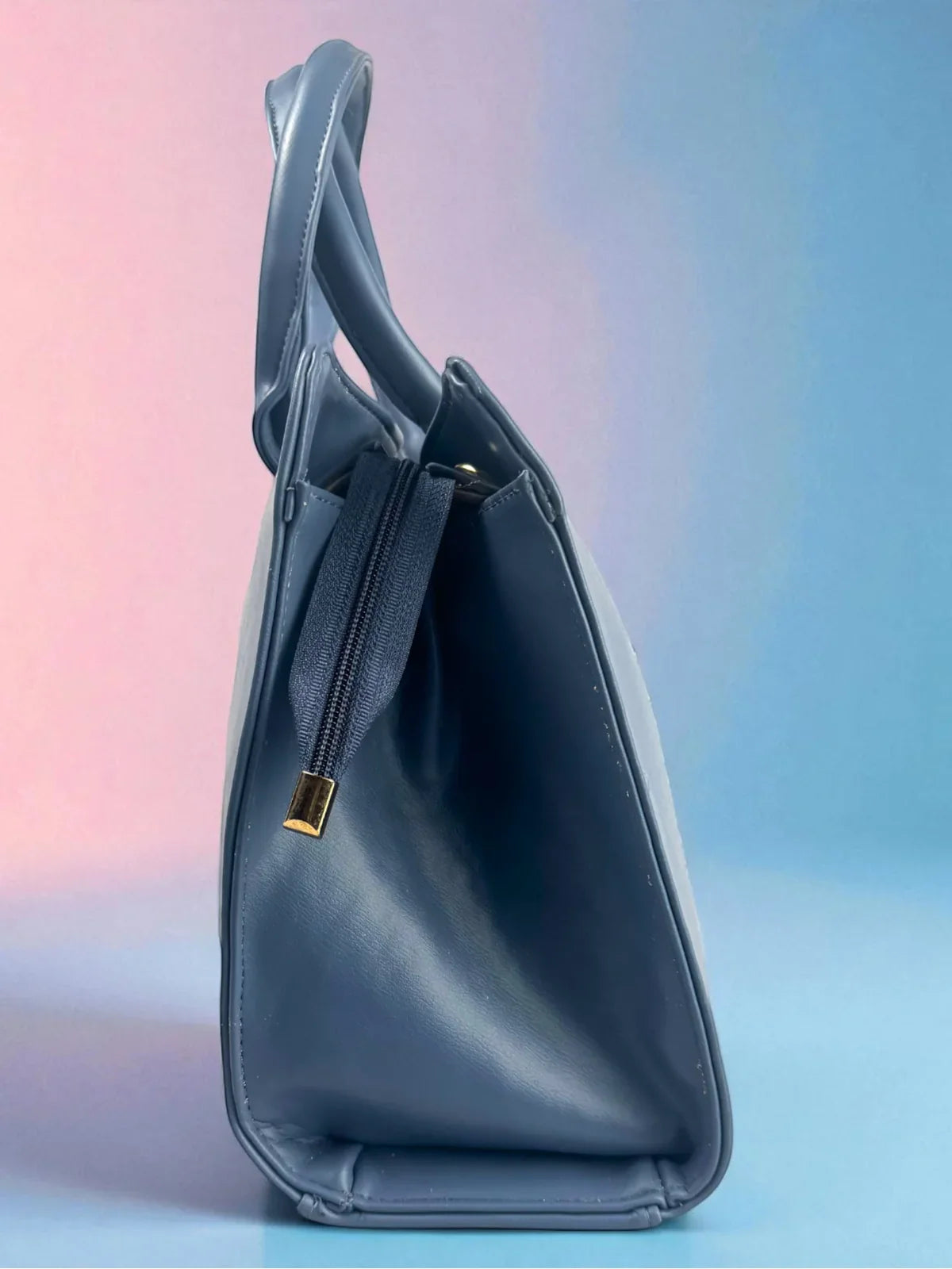 Tarani blue PU leather handbag side profile with golden zip stylish and elegant