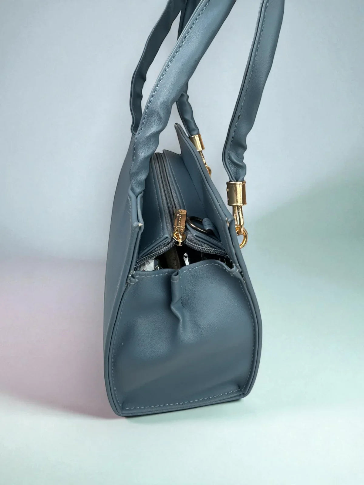 Tarani PU leather blue handbag side view spacious style