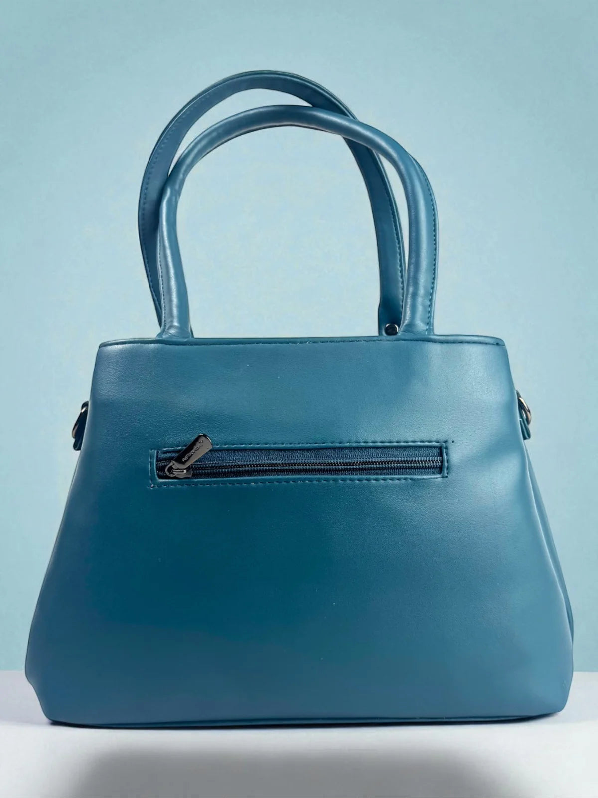 Tarani blue PU leather handbag back view with zipper pocket and premium finish