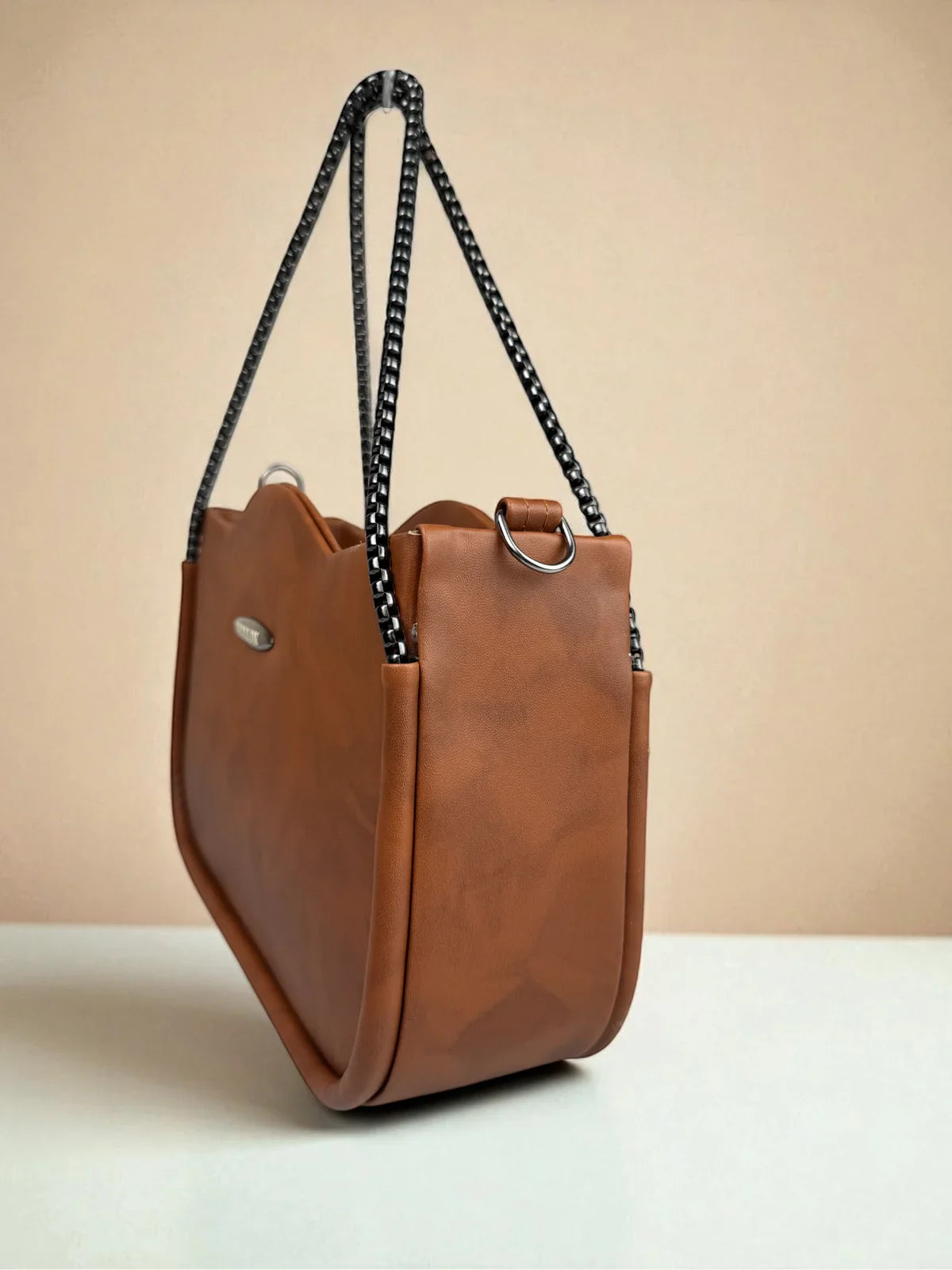 Tarani brown PU leather handbag stylish side profile for casual and festive use