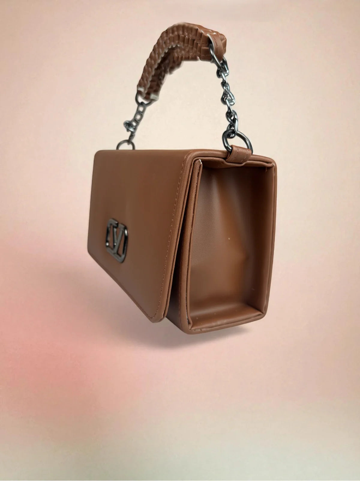 Tarani brown handbag side view with chain strap