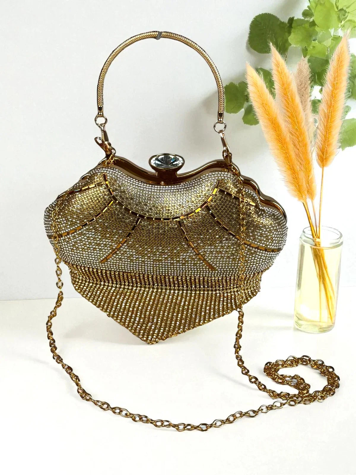 Tarani golden PU leather handbag with crystal clasp for festive occasions