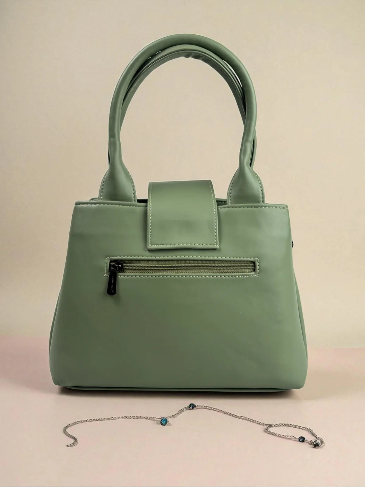 Tarani green PU leather handbag back view with zipper pocket