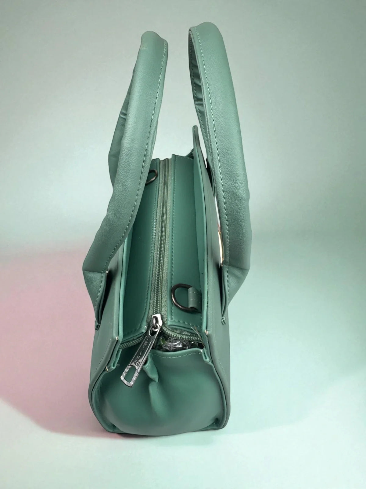 Tarani green PU leather handbag secure top zip view for modern women