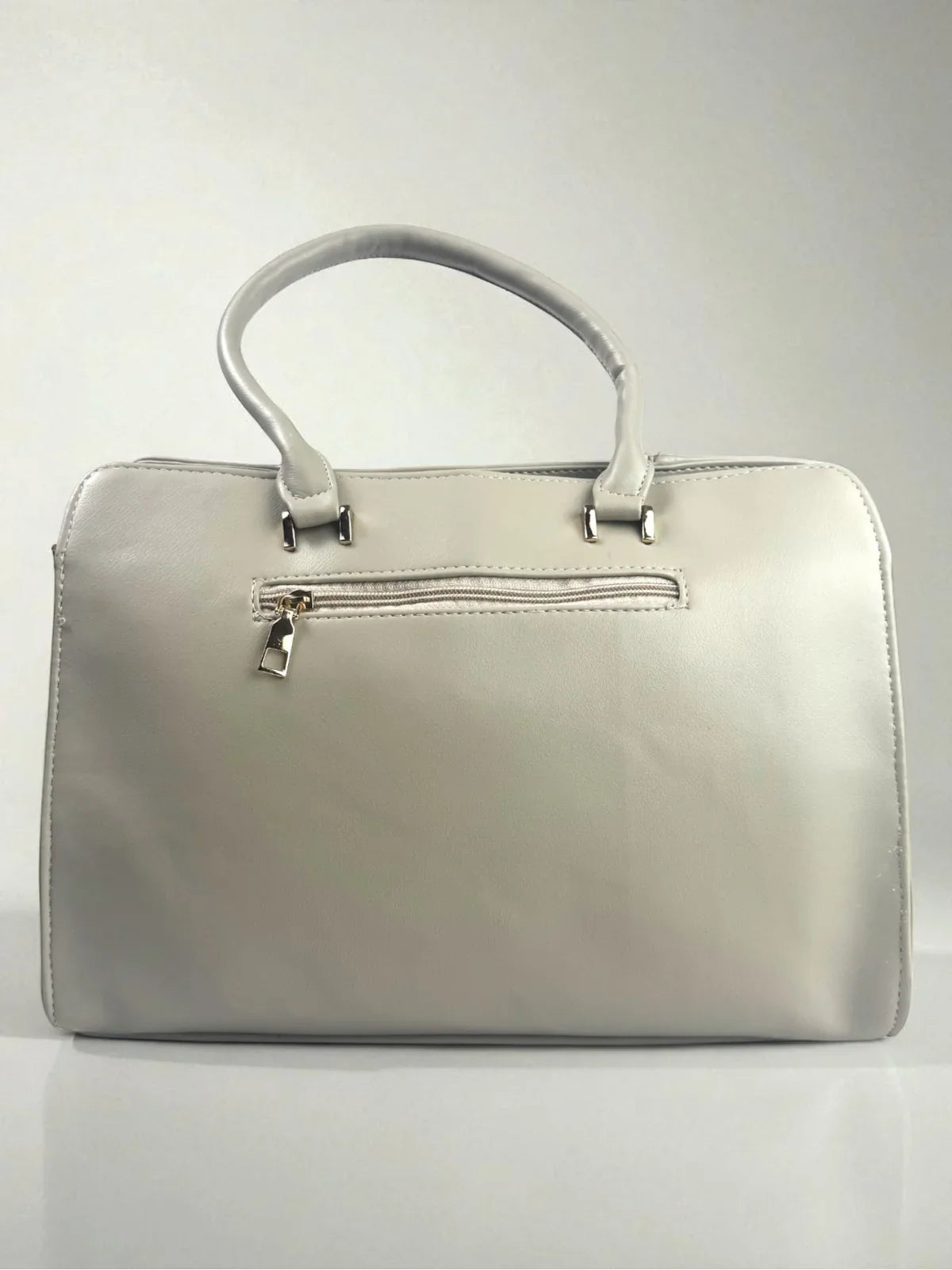 Tarani grey PU leather handbag back view with zip closure