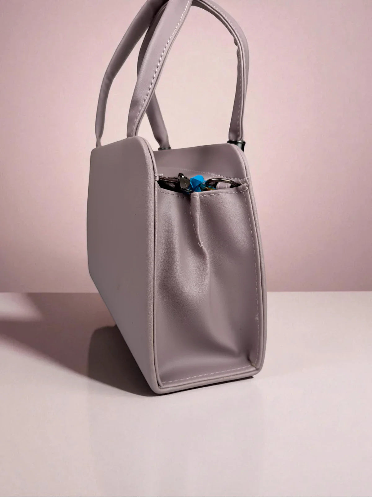 Tarani lavender PU leather handbag side view stylish profile