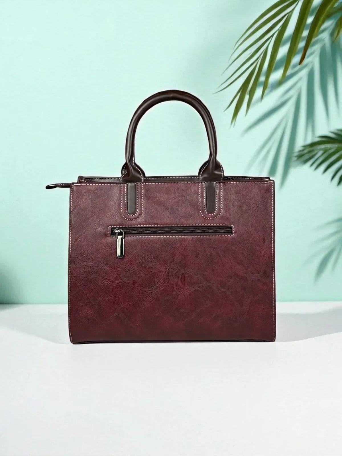 Tarani PU leather maroon handbag artistic back view design elegant and durable