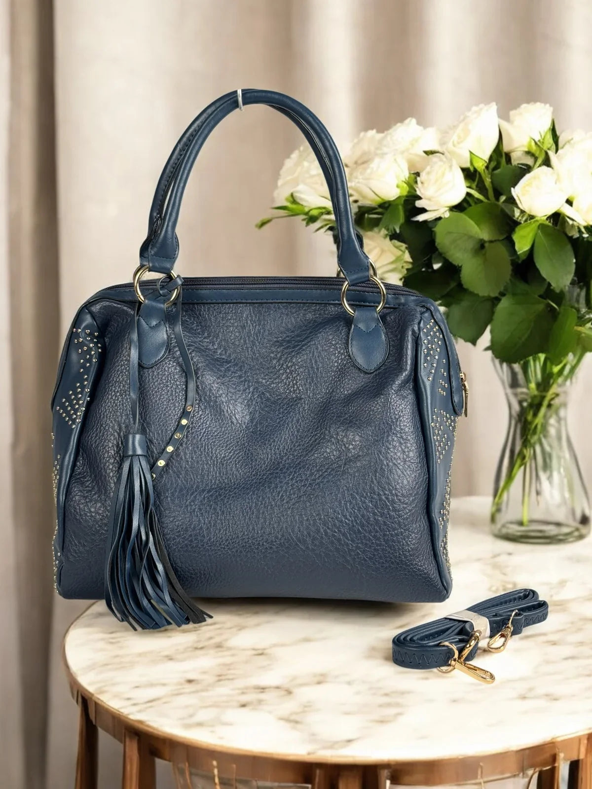 Tarani navy blue PU leather handbag with tassel design and golden studs for festive and office use