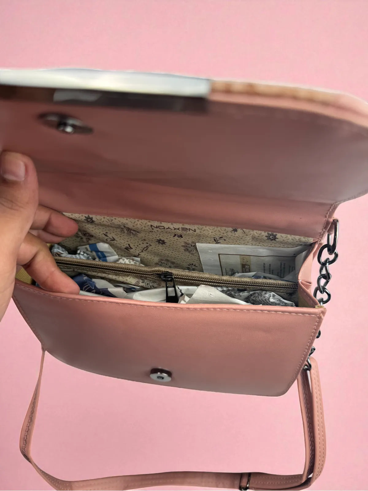 Tarani nude pink PU leather handbag spacious interior closeup