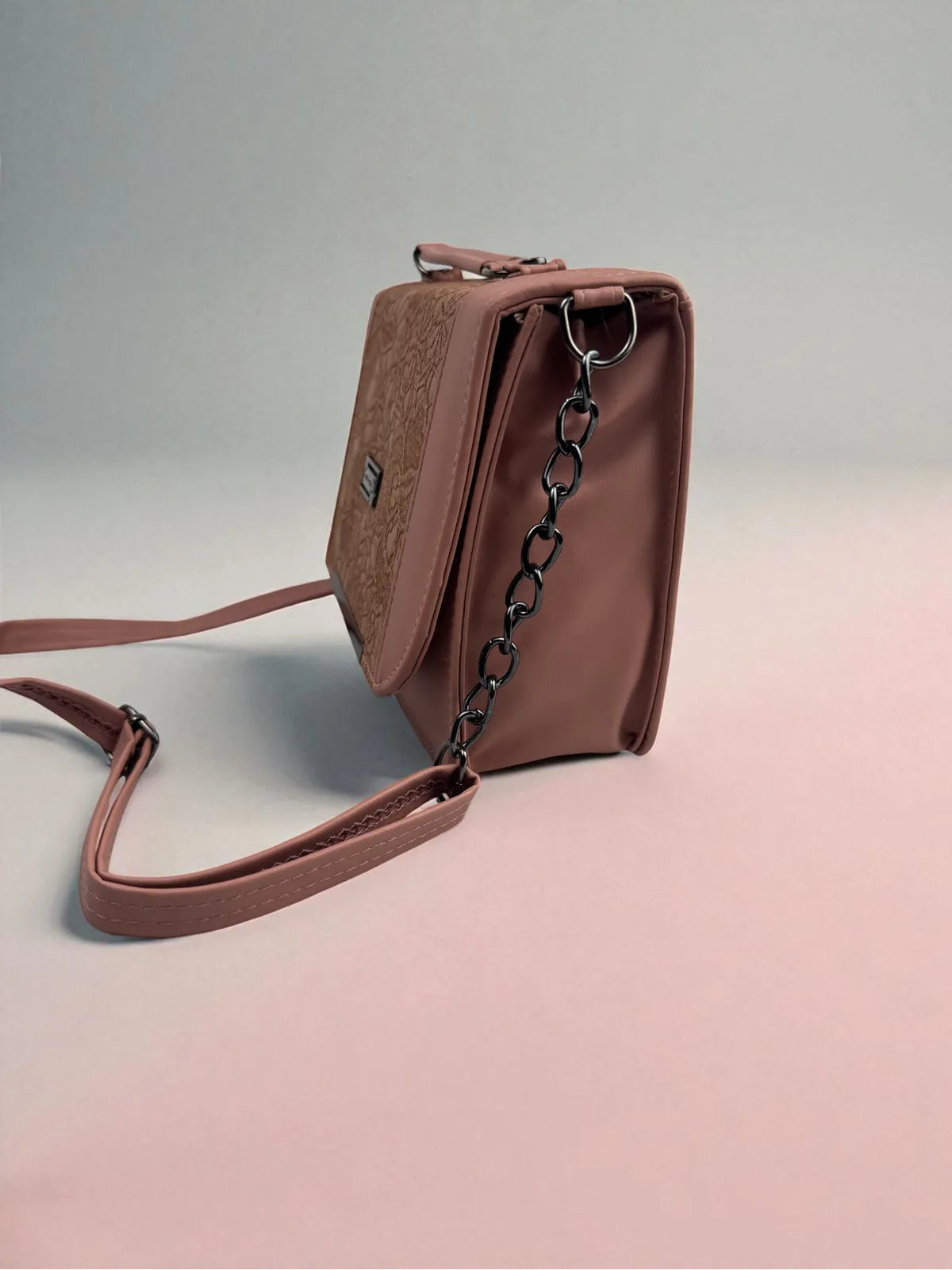 Tarani nude pink PU leather handbag stylish side view with chain strap