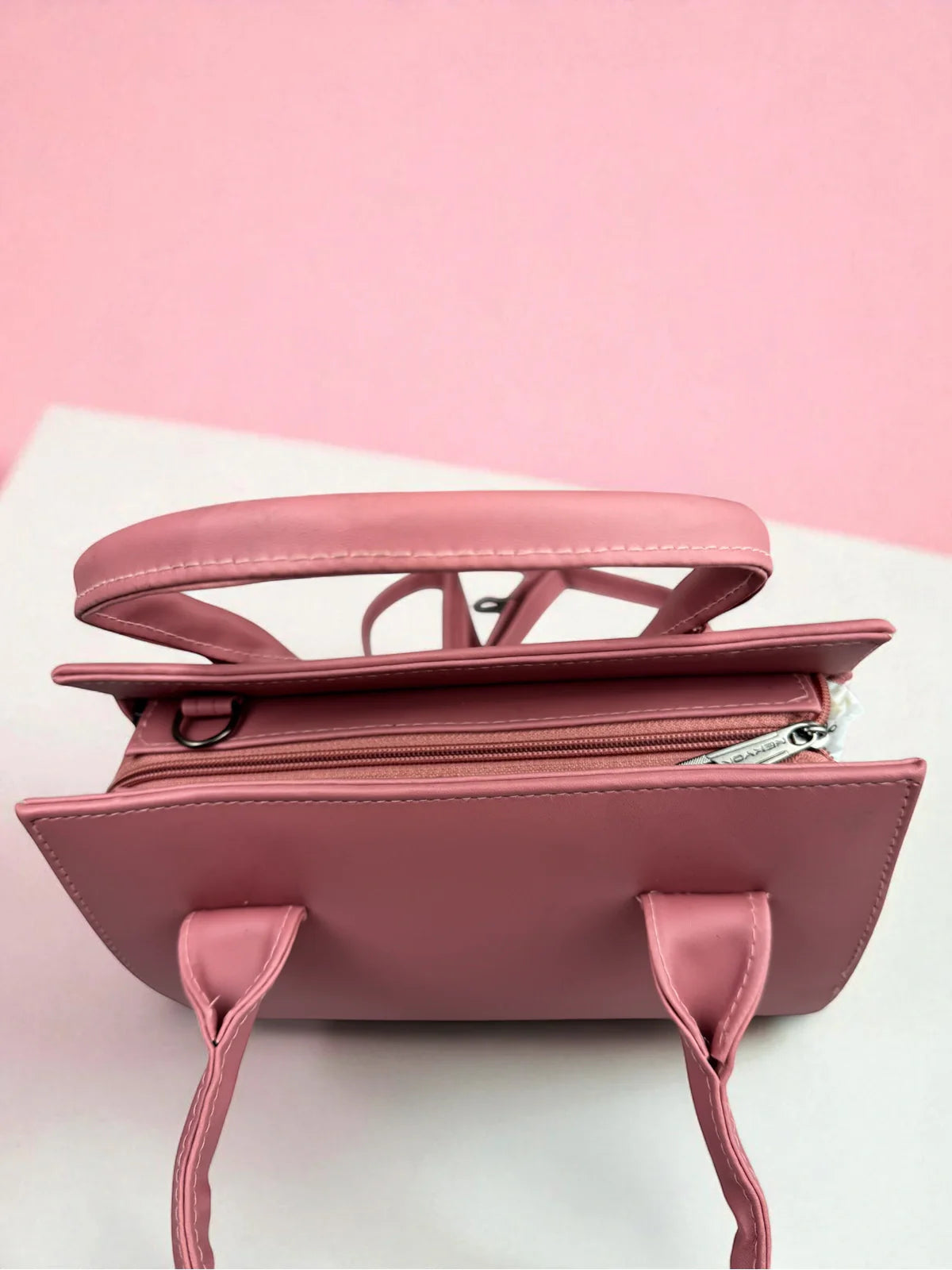 Tarani pink PU leather handbag elegant top view