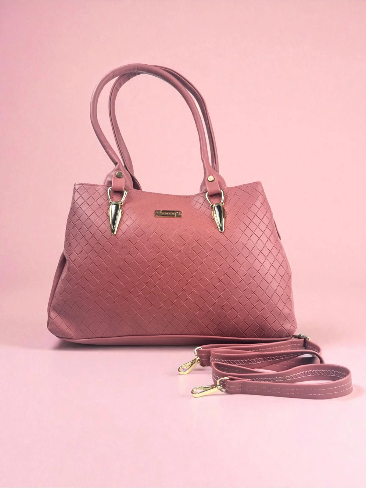 Tarani pink PU leather handbag front view with textured design