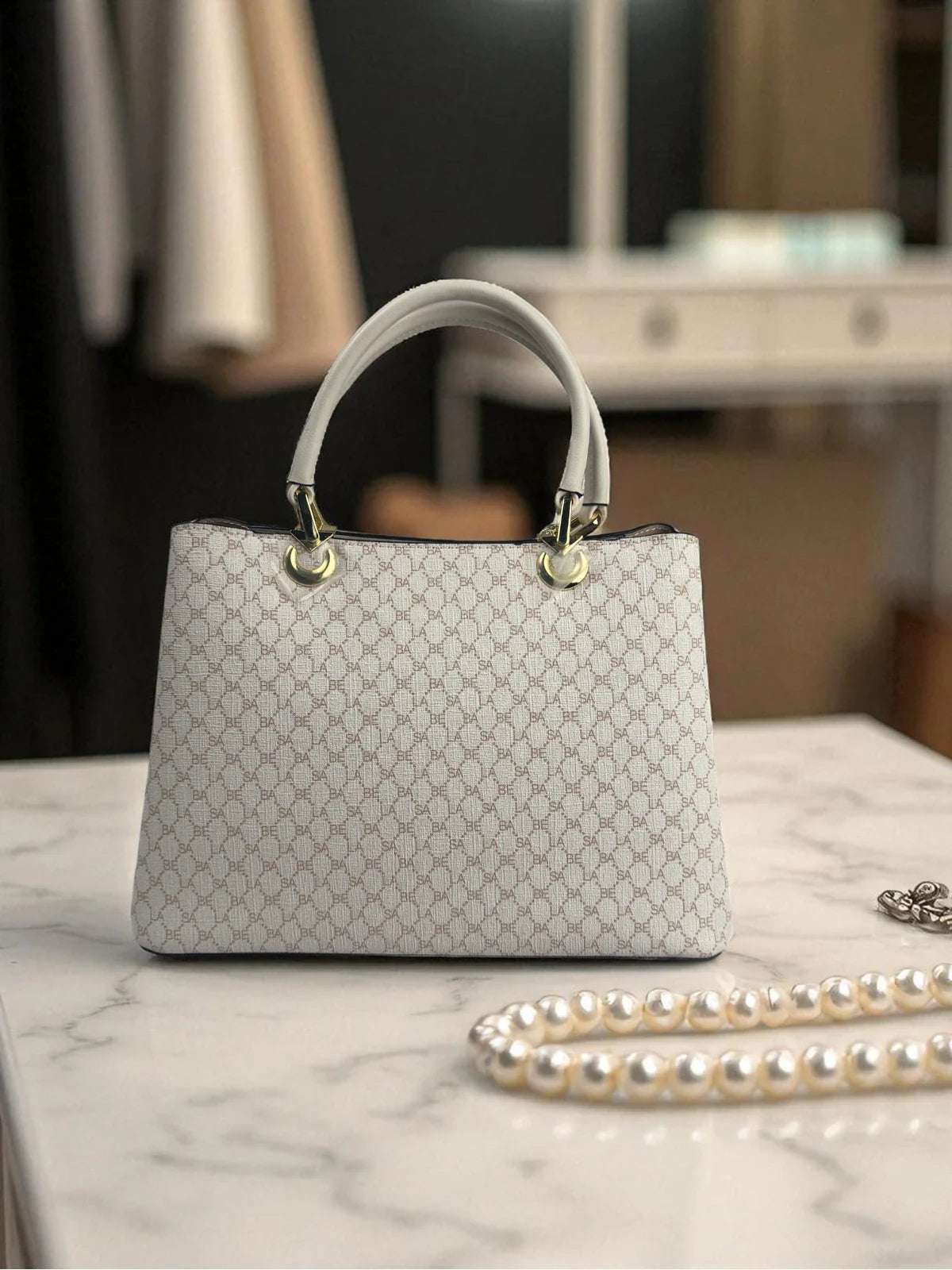 Tarani handbag back view PU leather monogram design