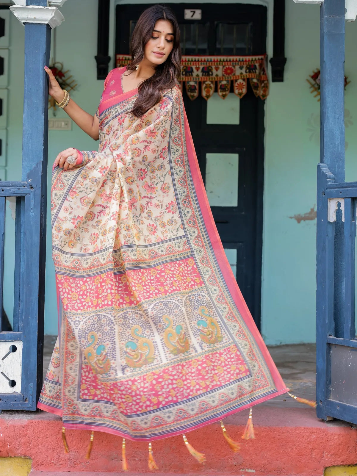 Tarani Shivika premium handloom beige saree pallu view with heritage motifs and tassels