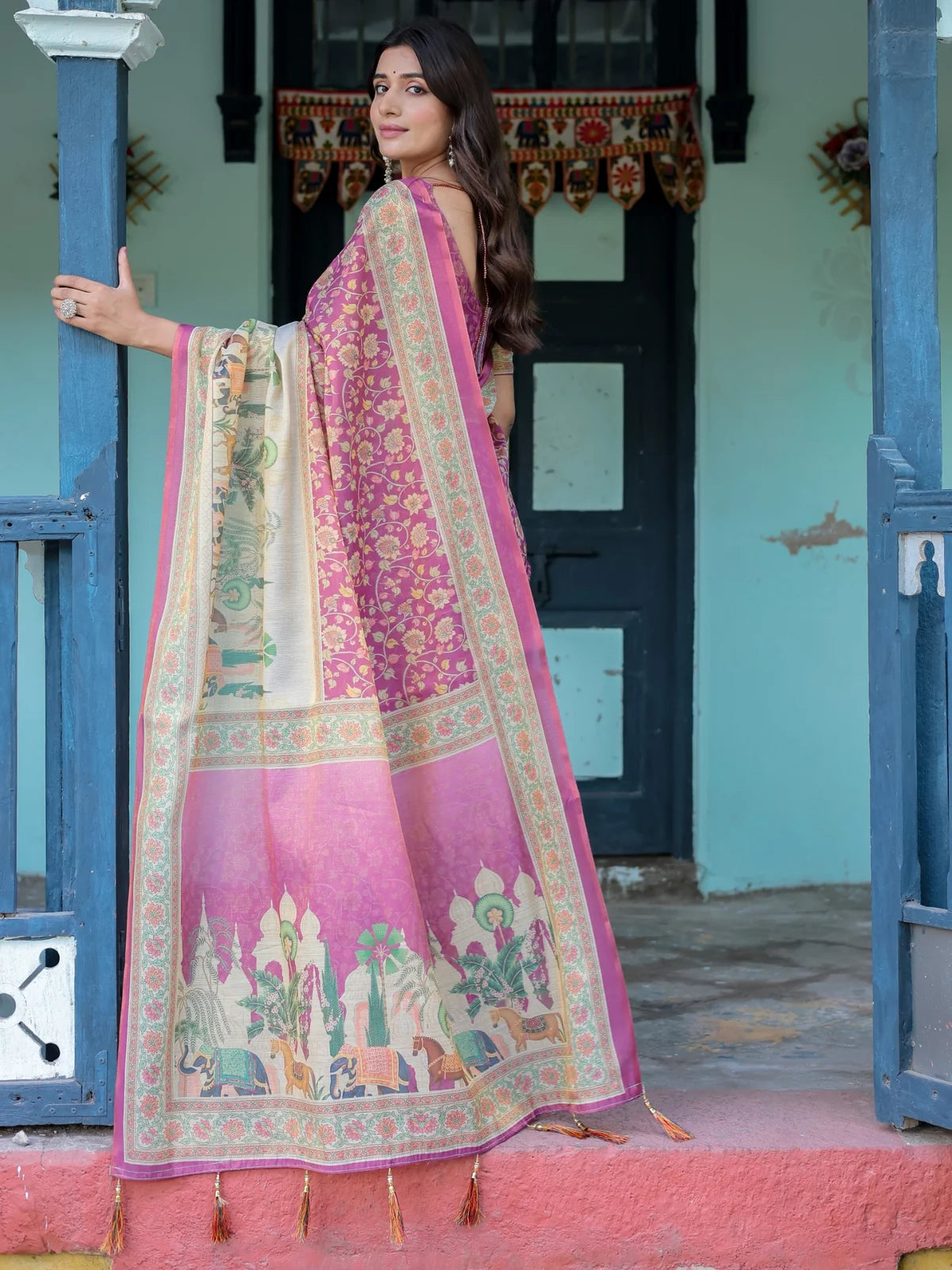 Tarani Samruddhi handloom magenta saree back view featuring artistic pallu and decorative tassels