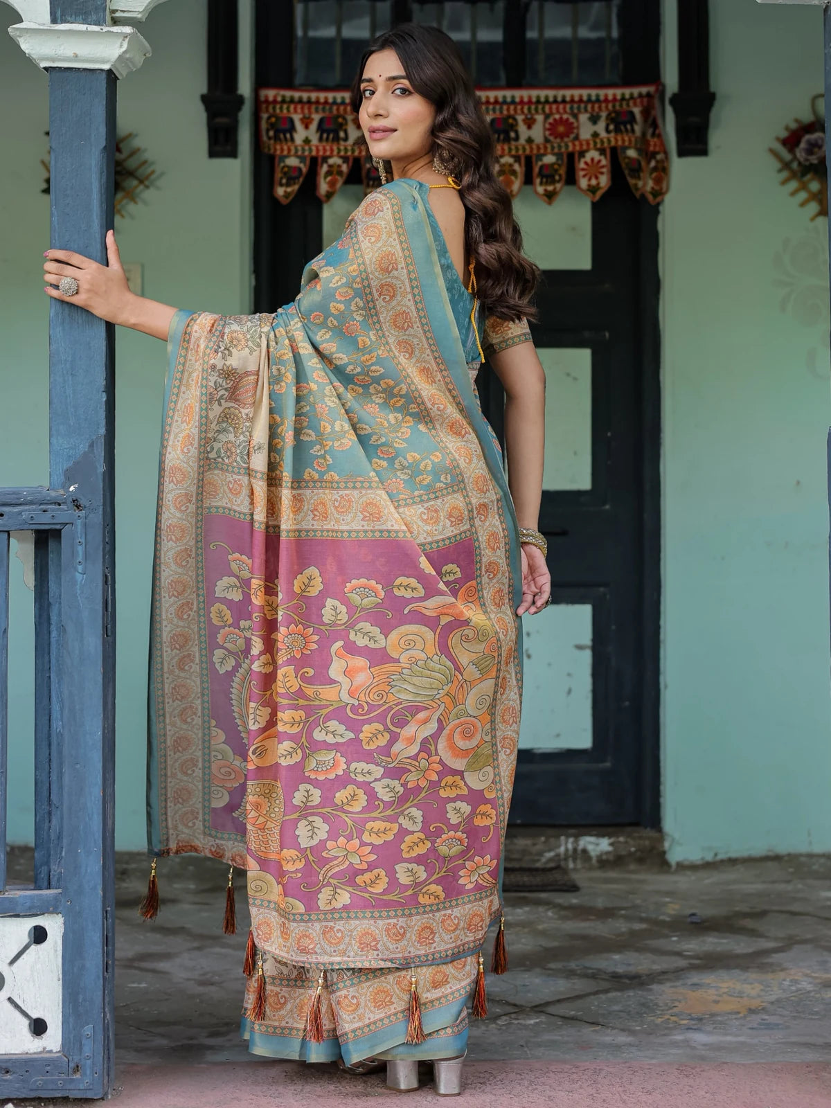 Tarani teal premium handloom saree back view with artistic pallu tassels and blouse design Lipisha