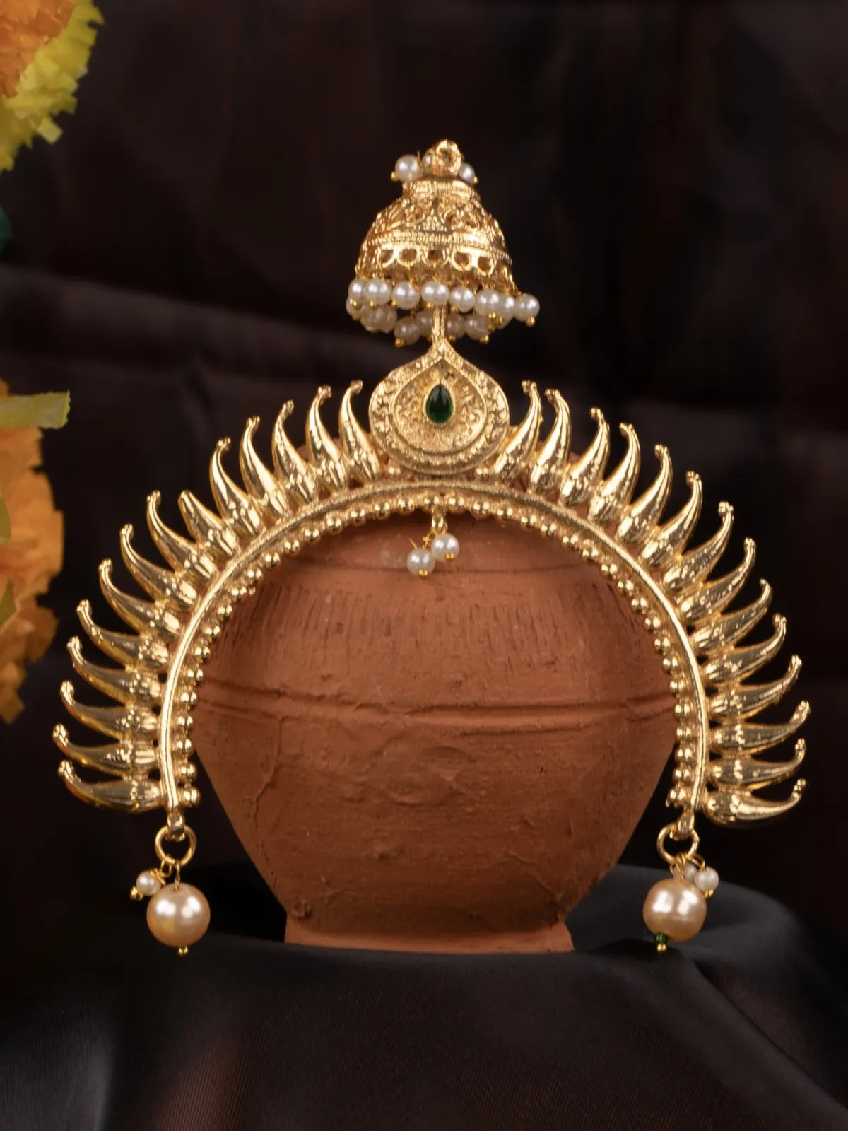 Tarani closeup view of gold plated pearl headpiece with antique detailing