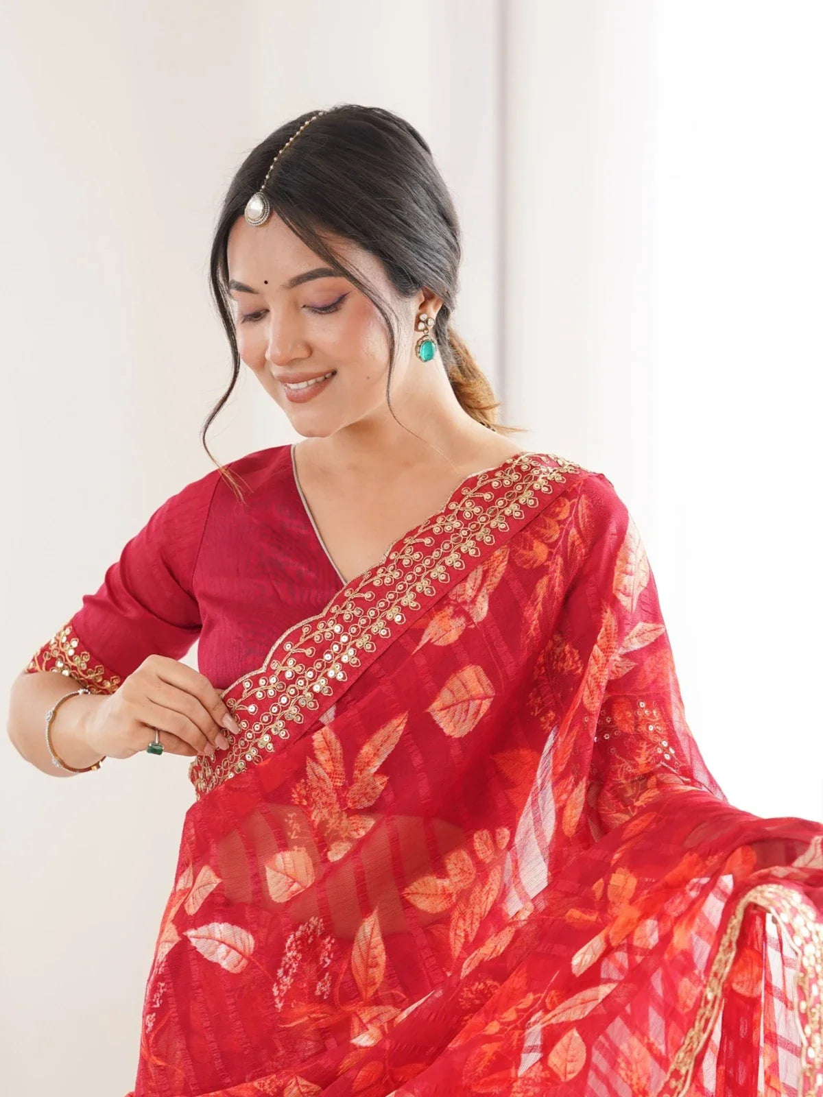 Tarani red saree upper body view with floral prints and red blouse detailing