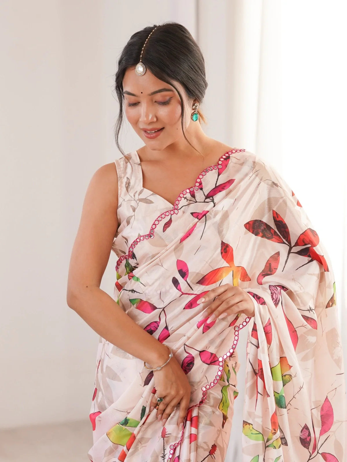 Tarani pink Chinnon saree upper body shot with ruffle blouse and print work