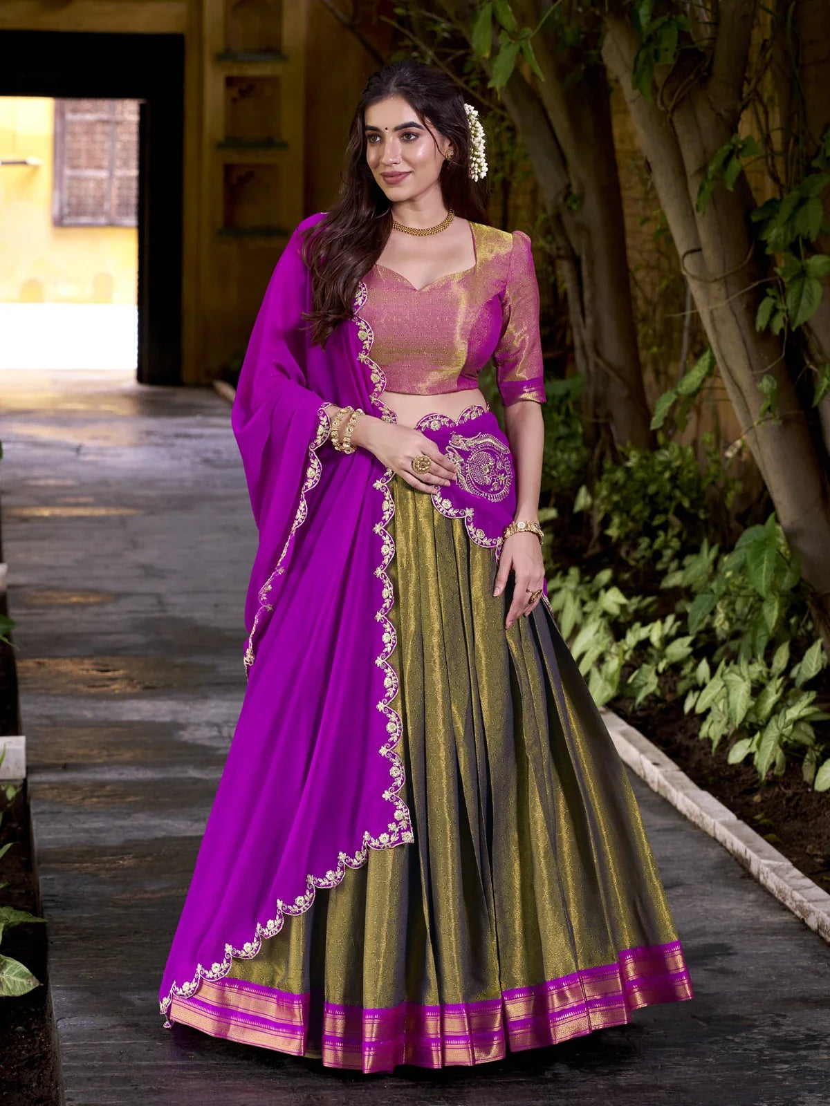 Tarani green kanchipuram lehenga full view with zari blouse and embroidered purple dupatta