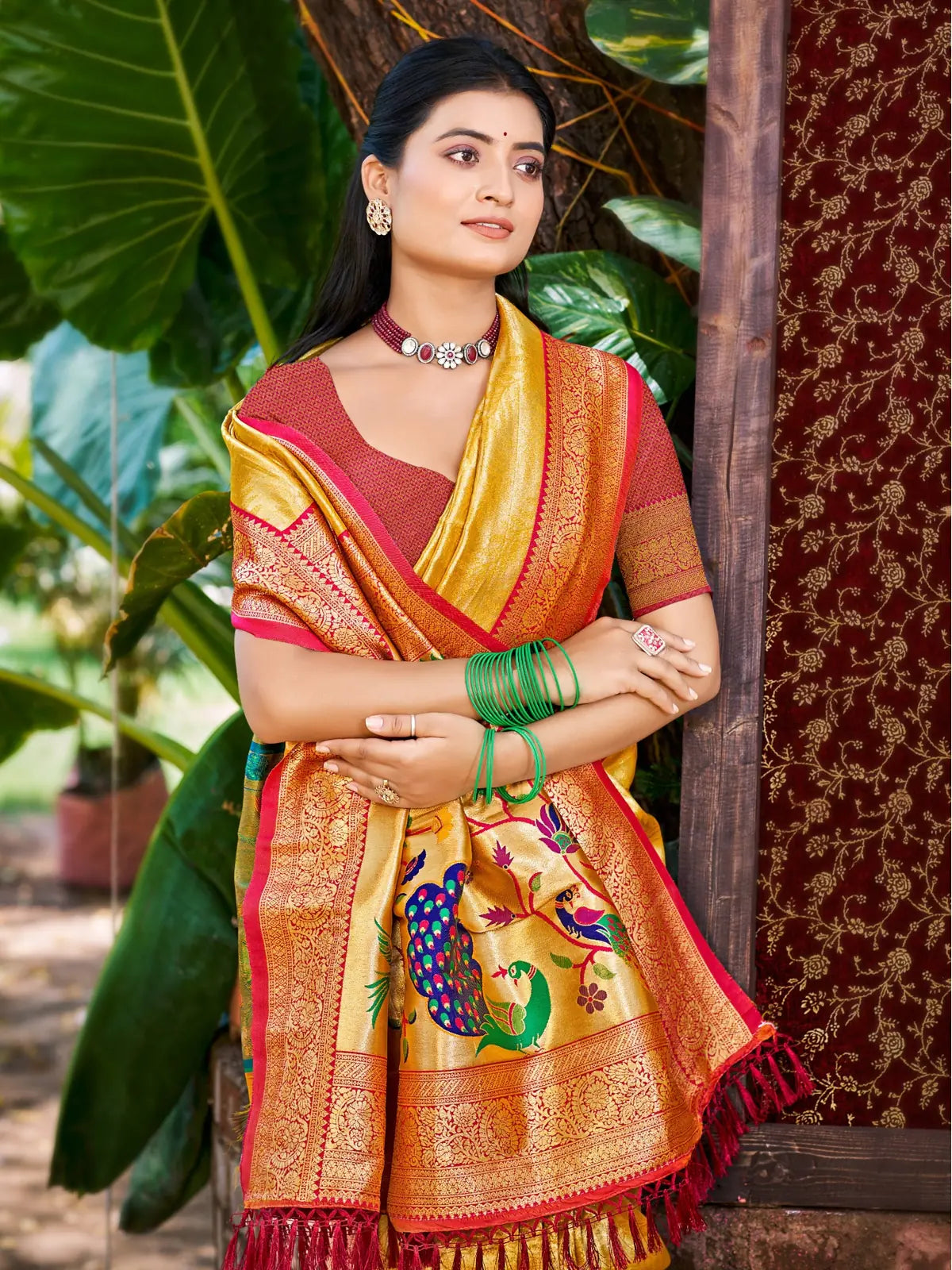 Tarani yellow Kanjivaram silk saree upper body view with woven design and red blouse
