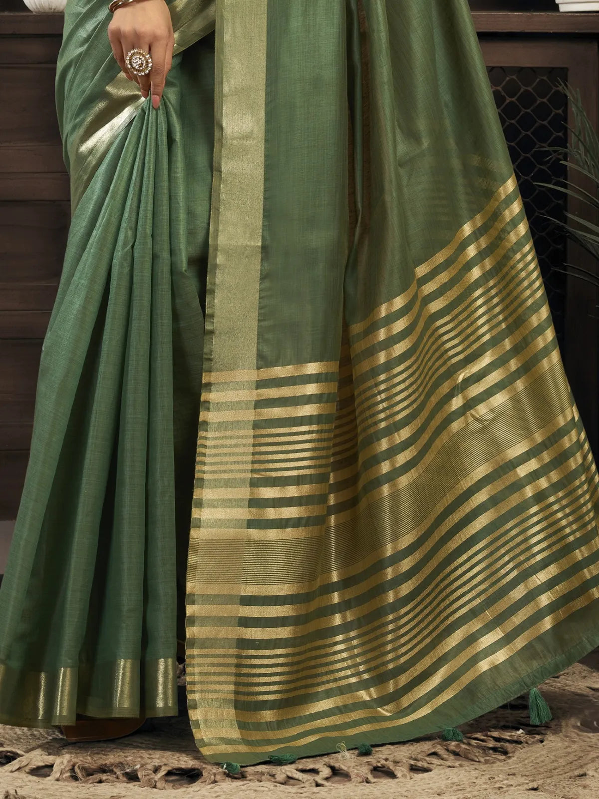 Tarani khadi cotton saree with golden zari pallu border green tone closeup