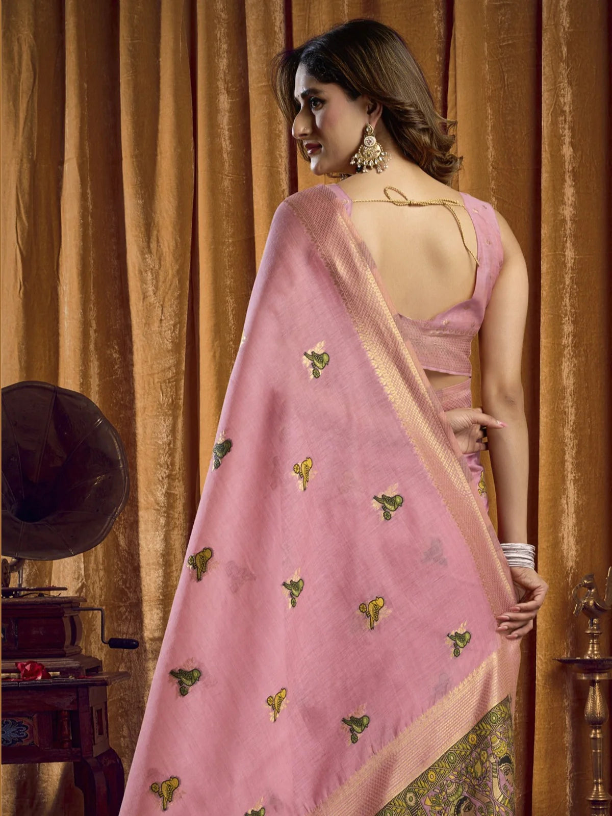 Tarani back view of pink khadi cotton saree showing elegant fall and bird motifs