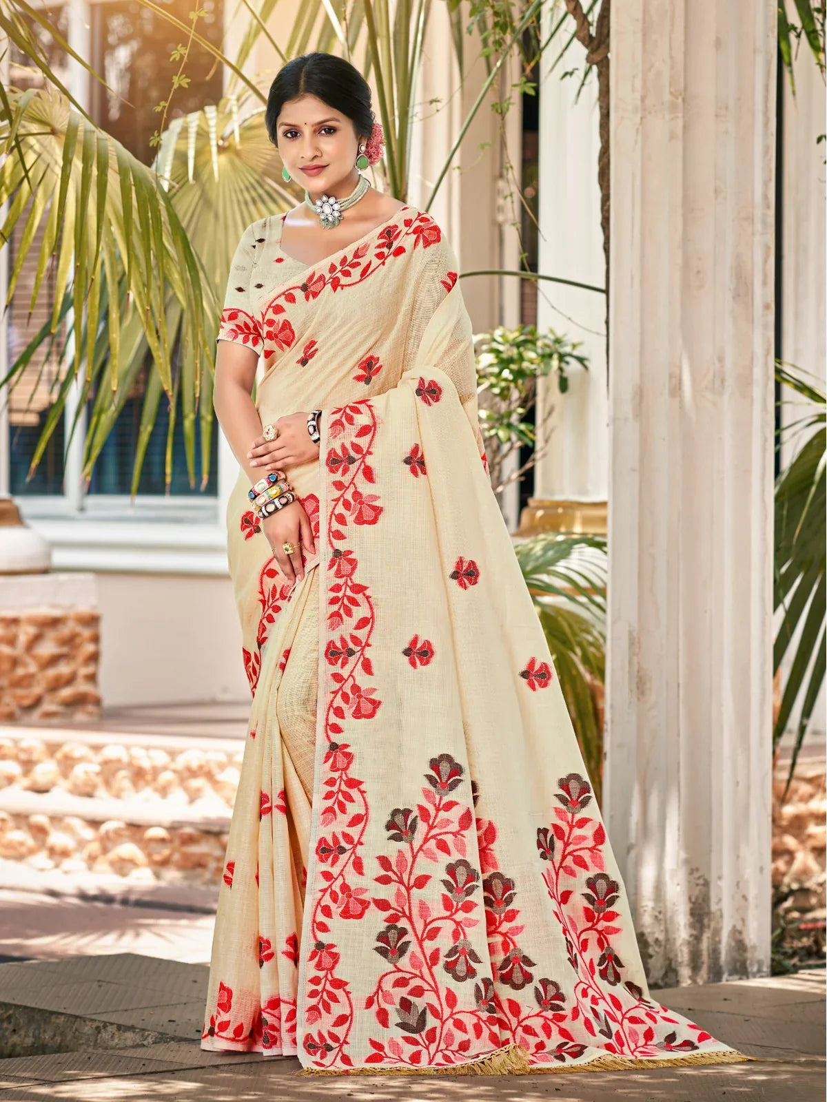 Tarani cream Lilen saree with red floral embroidery perfect for festive wear