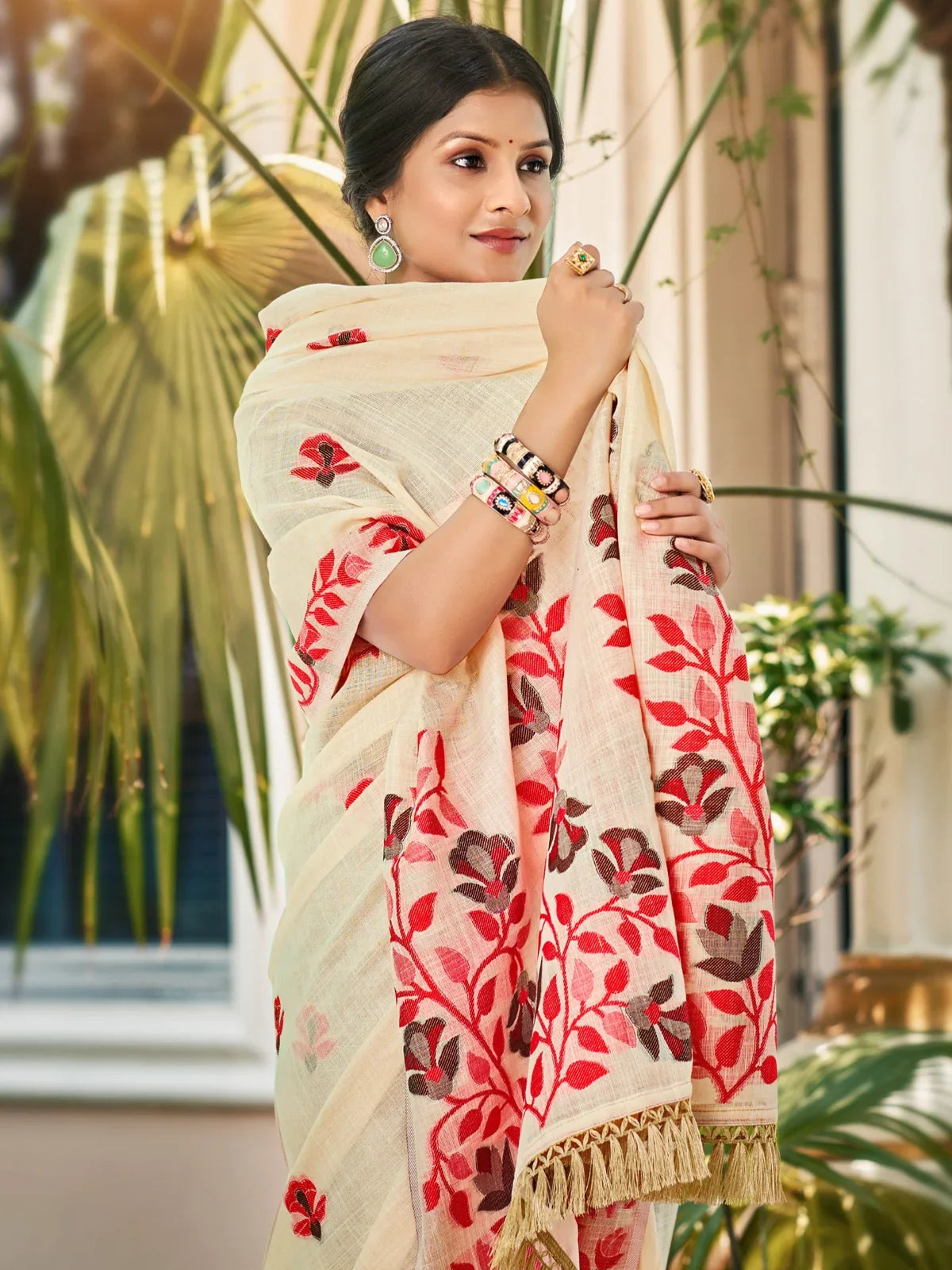 Tarani Lilen saree upper body view showing red floral embroidery and elegant drape