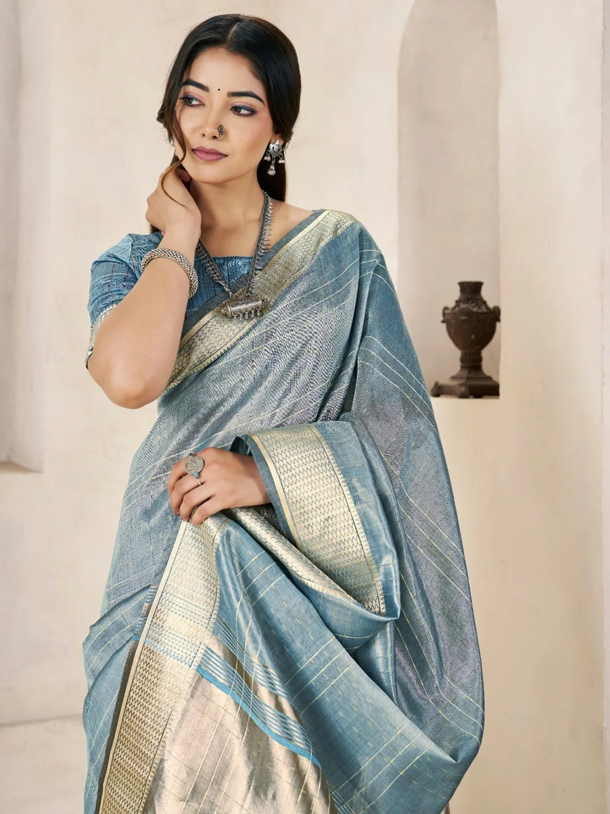 Tarani blue linen cotton silk saree closeup showcasing texture and zari work