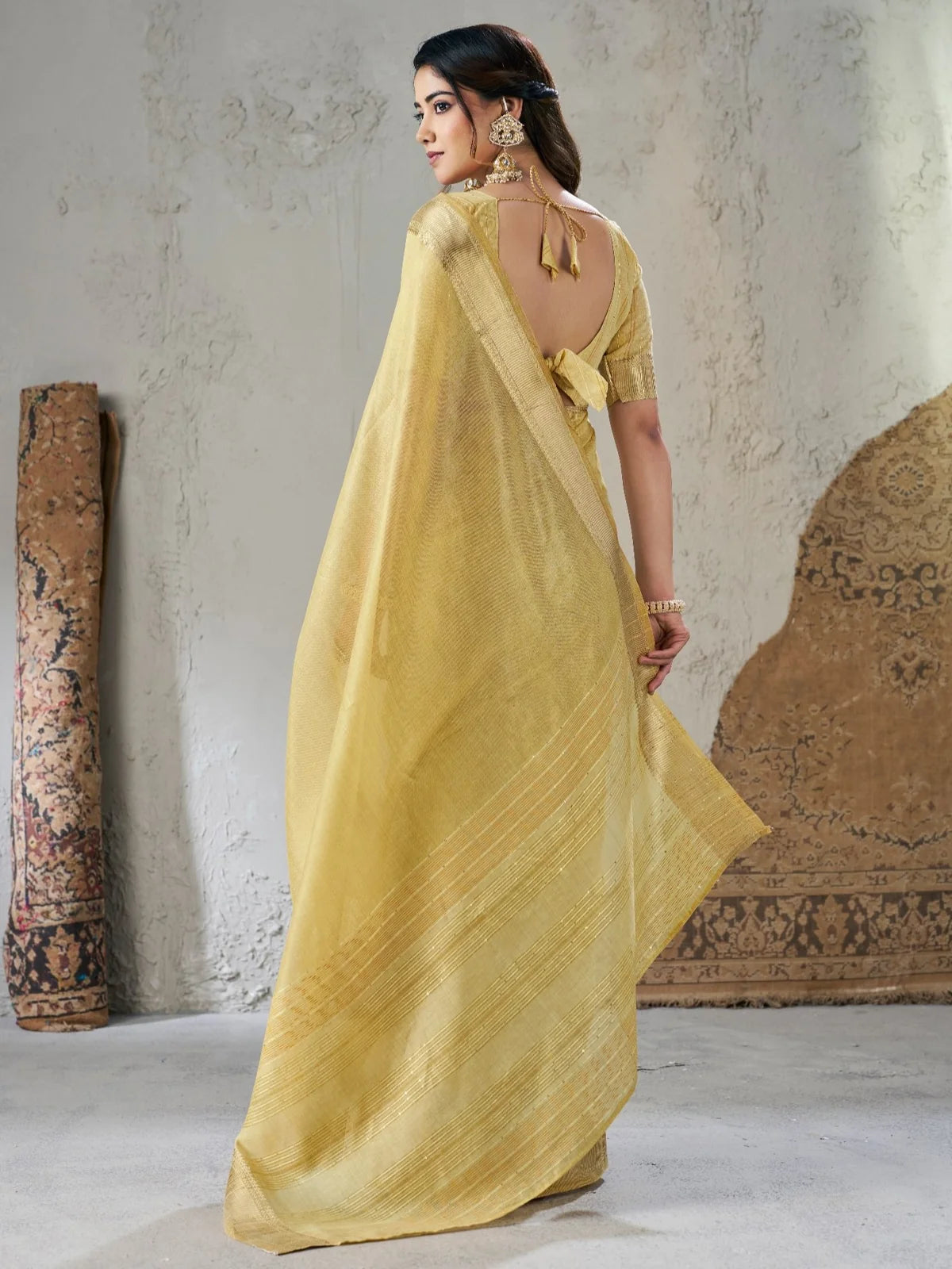 Tarani golden soft linan cotton silk saree back view highlighting blouse design and flowing pallu