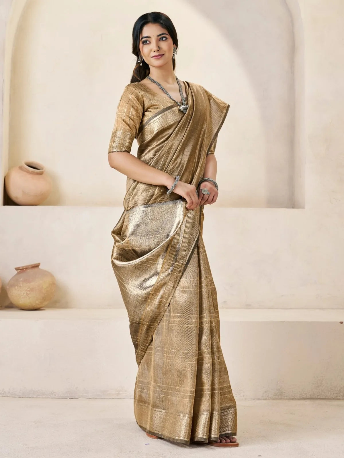 Tarani golden party wear saree front drape view with elegant shine