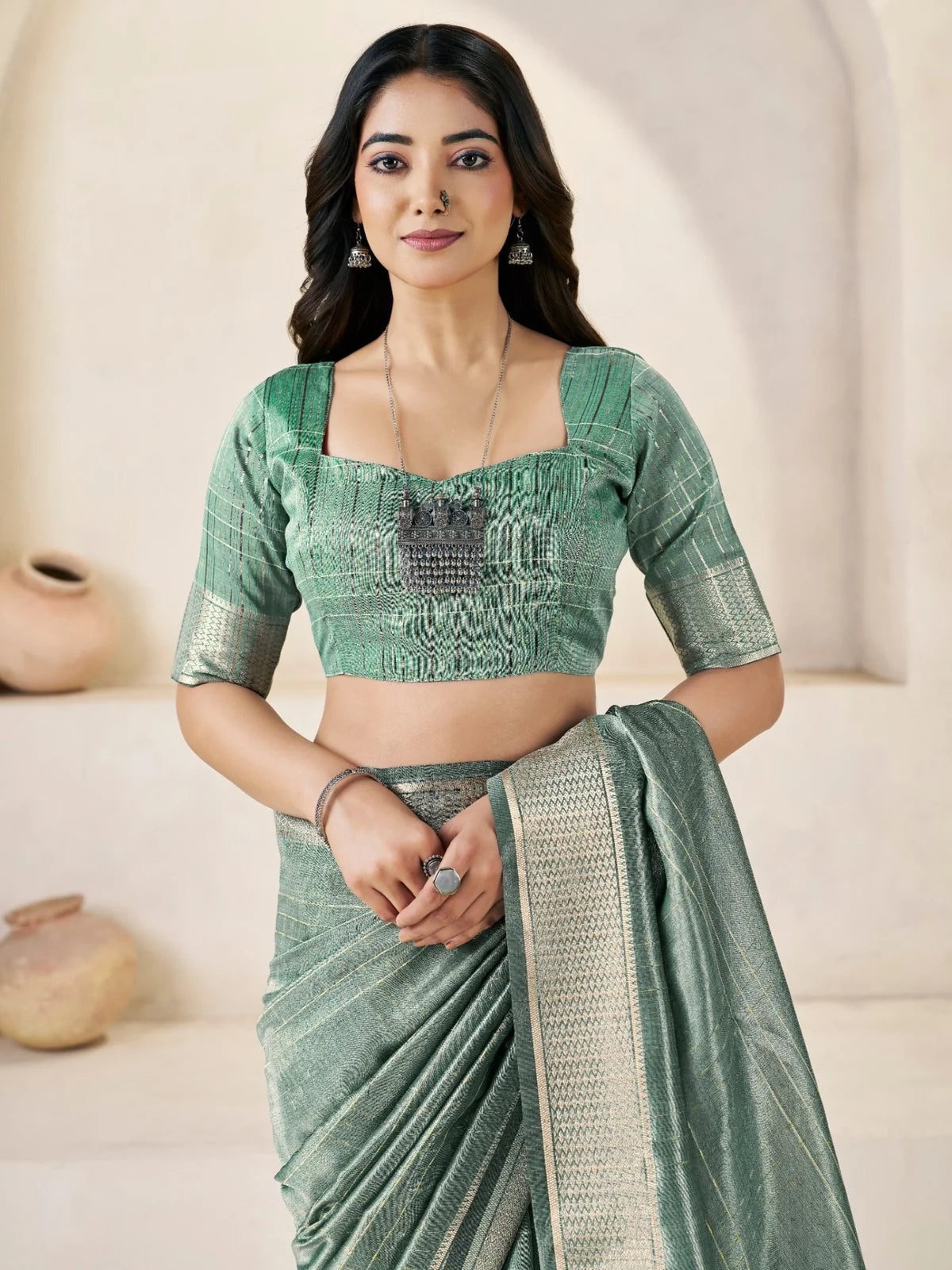 Tarani sea green linen cotton silk saree blouse and upper body view with zari border detailing