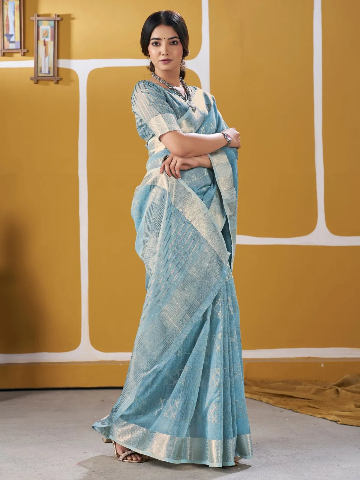 Tarani sky blue wedding wear saree front pose with matching blouse piece and zari work