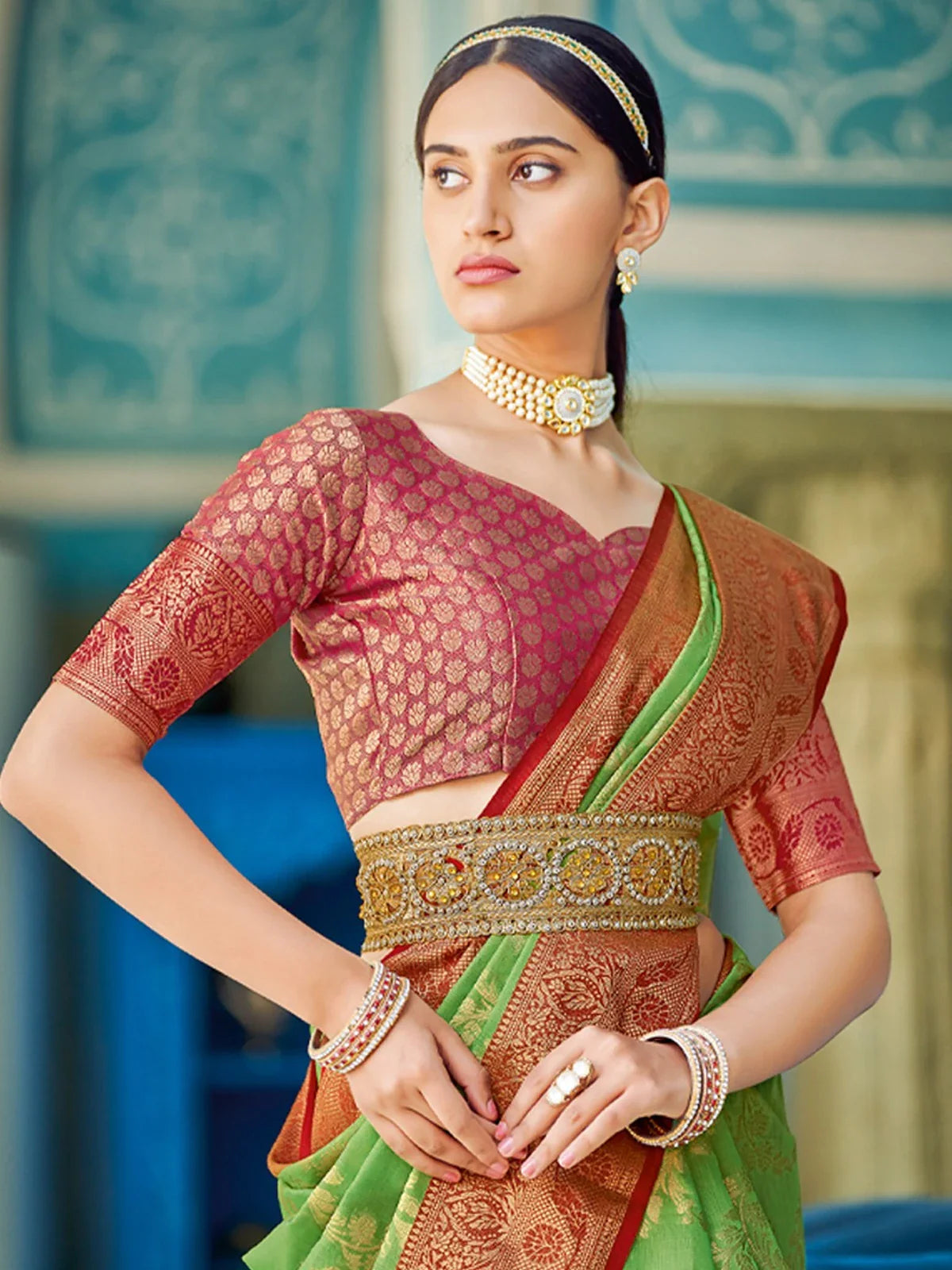 Tarani elegant green linen cotton saree upper body view with contrast maroon blouse and jewelry