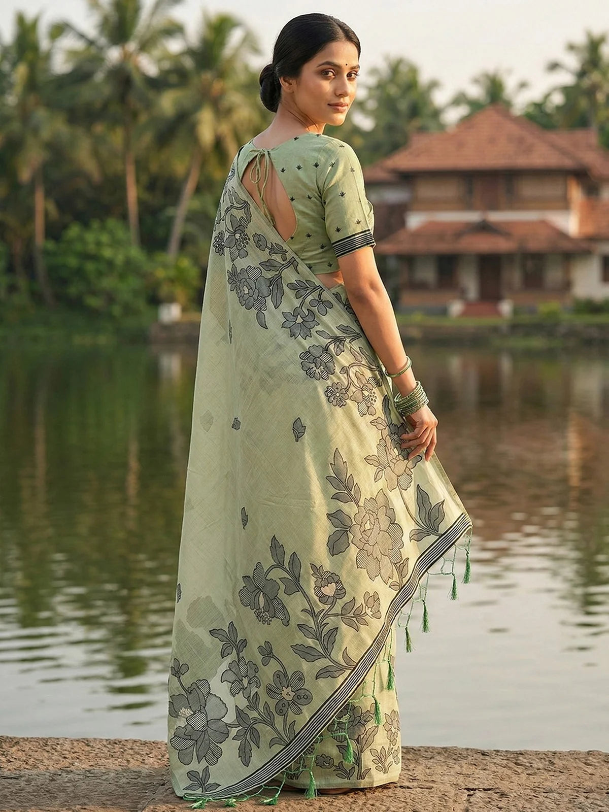 Tarani Gitanjali light green linen cotton saree back view with floral printed pallu and blouse