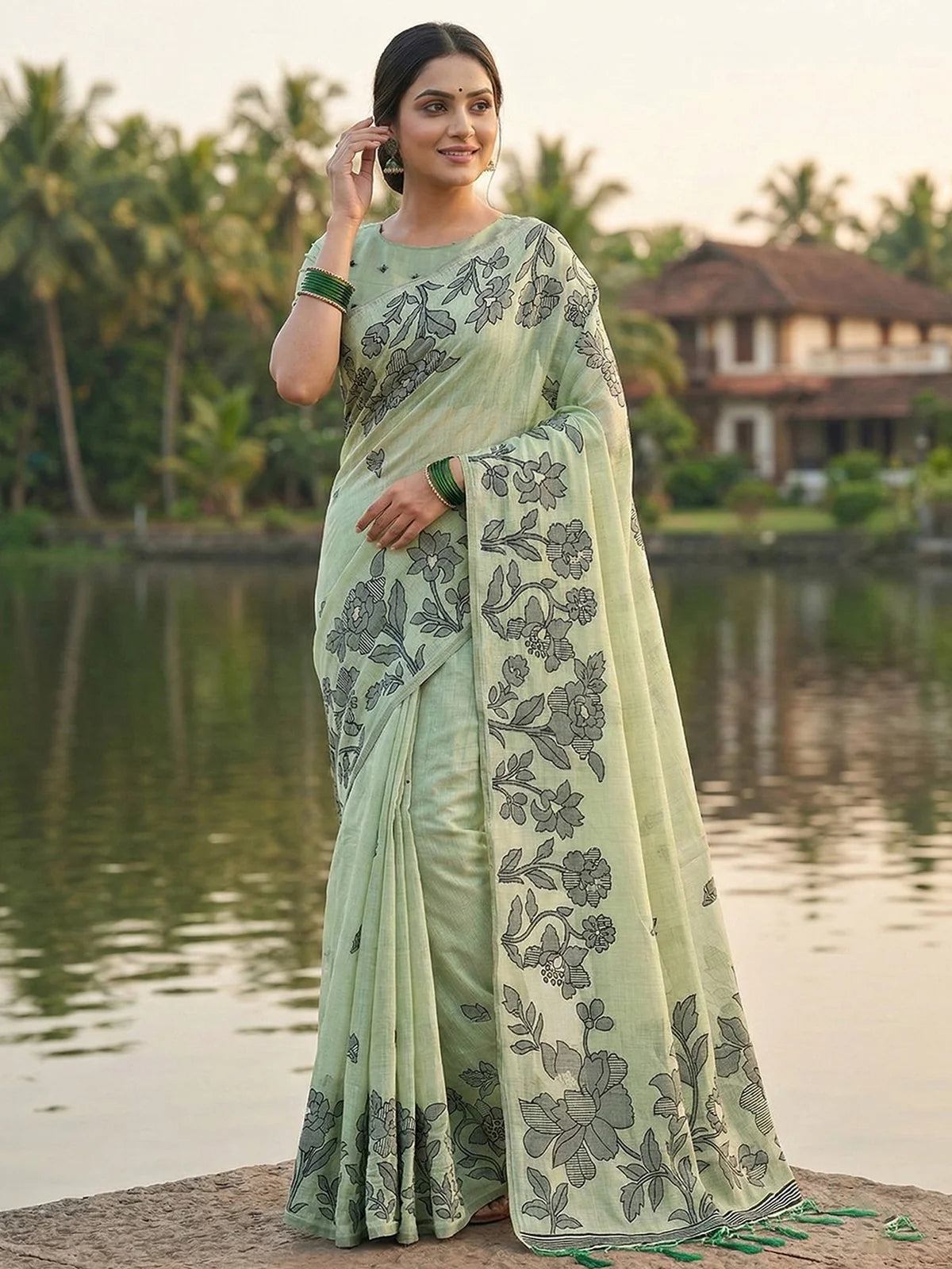 Tarani Gitanjali light green linen cotton saree with floral print front view for festive and party wear